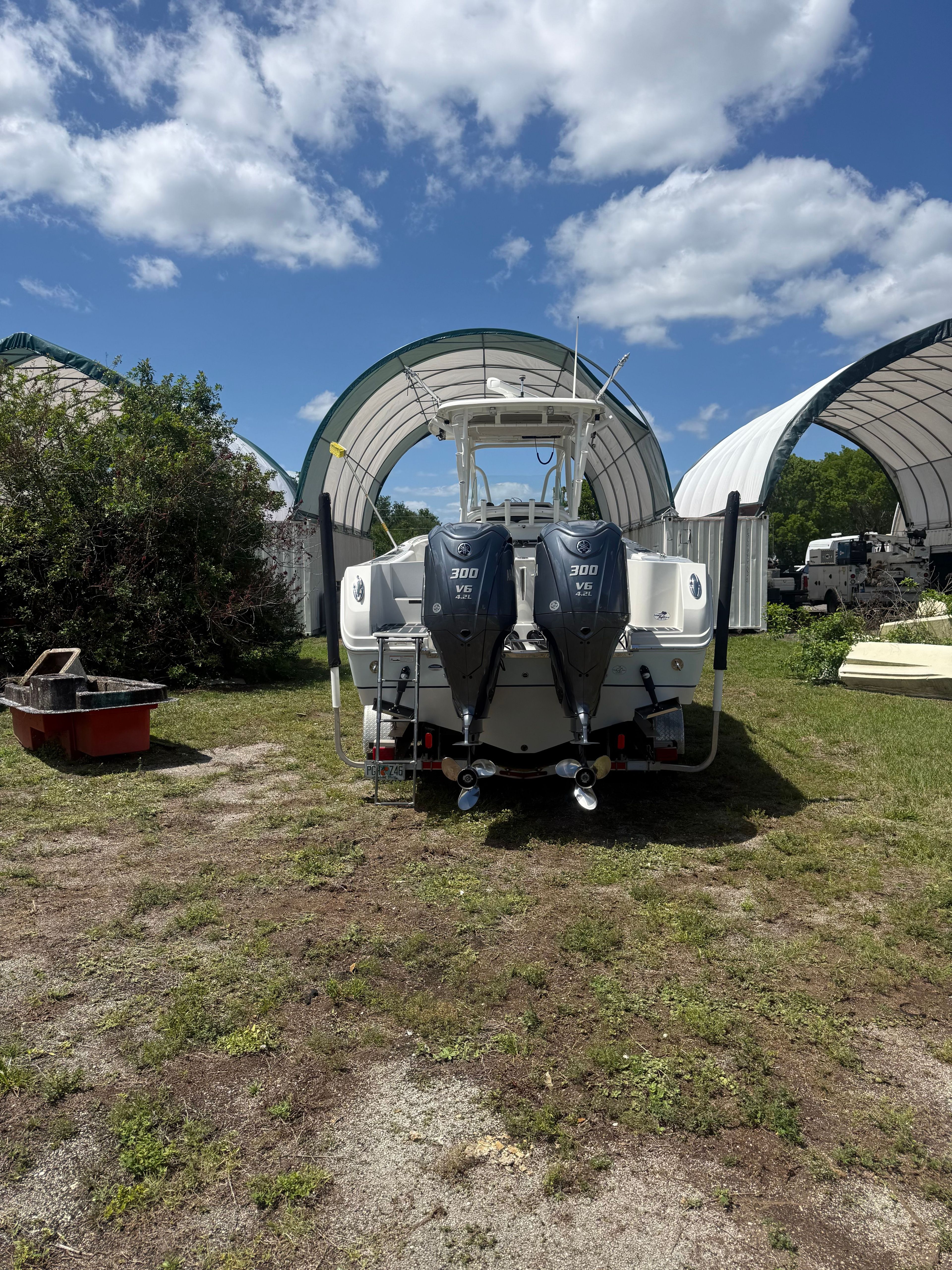 2015 Sailfish 290 CC boat with dual outboard engines.