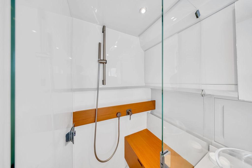 Modern shower area in 2021 Bluegame BG 42 yacht, featuring sleek design and glass enclosure.