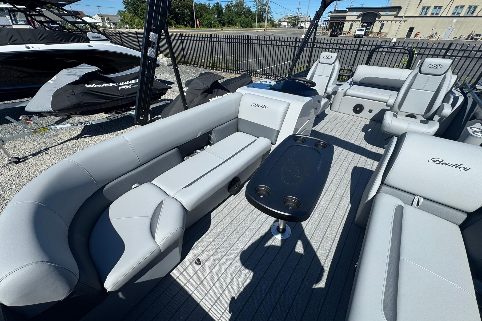2026 Bentley Pontoons Legacy 243 Swingback with luxurious seating and sleek design.