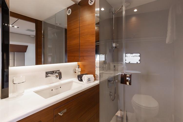 Luxurious bathroom interior of 2017 Princess 75 Motor Yacht with modern fixtures.