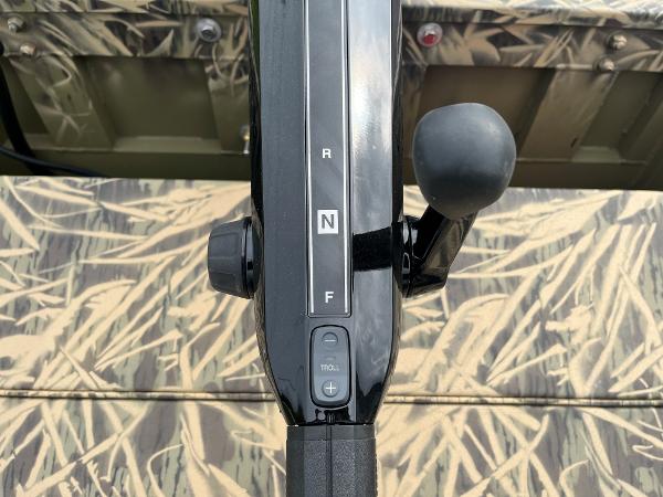 2024 Lowe Roughneck 1660 boat throttle control with camouflage pattern.