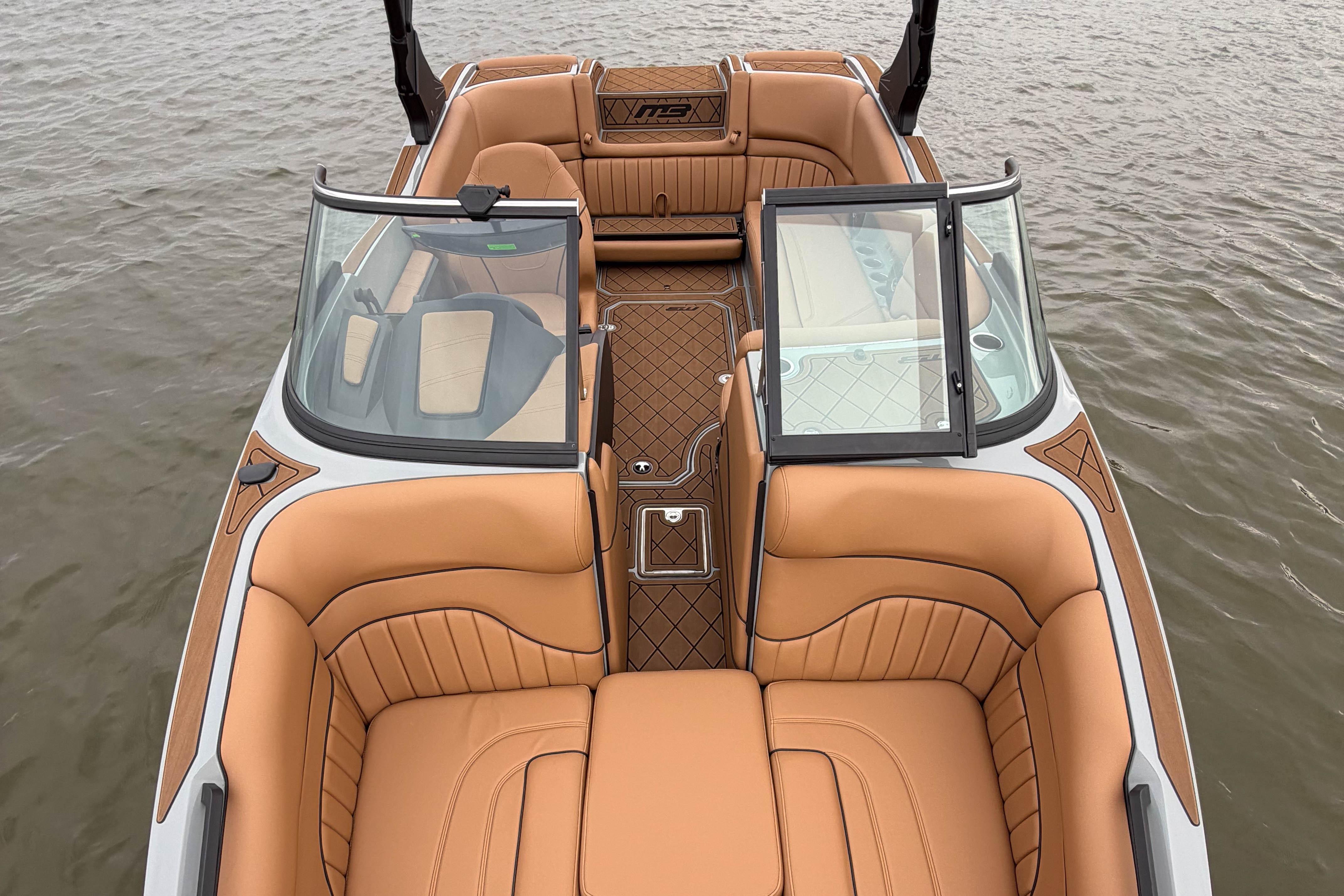 2026 MB B52 21 Alpha boat with luxurious tan interior on water.