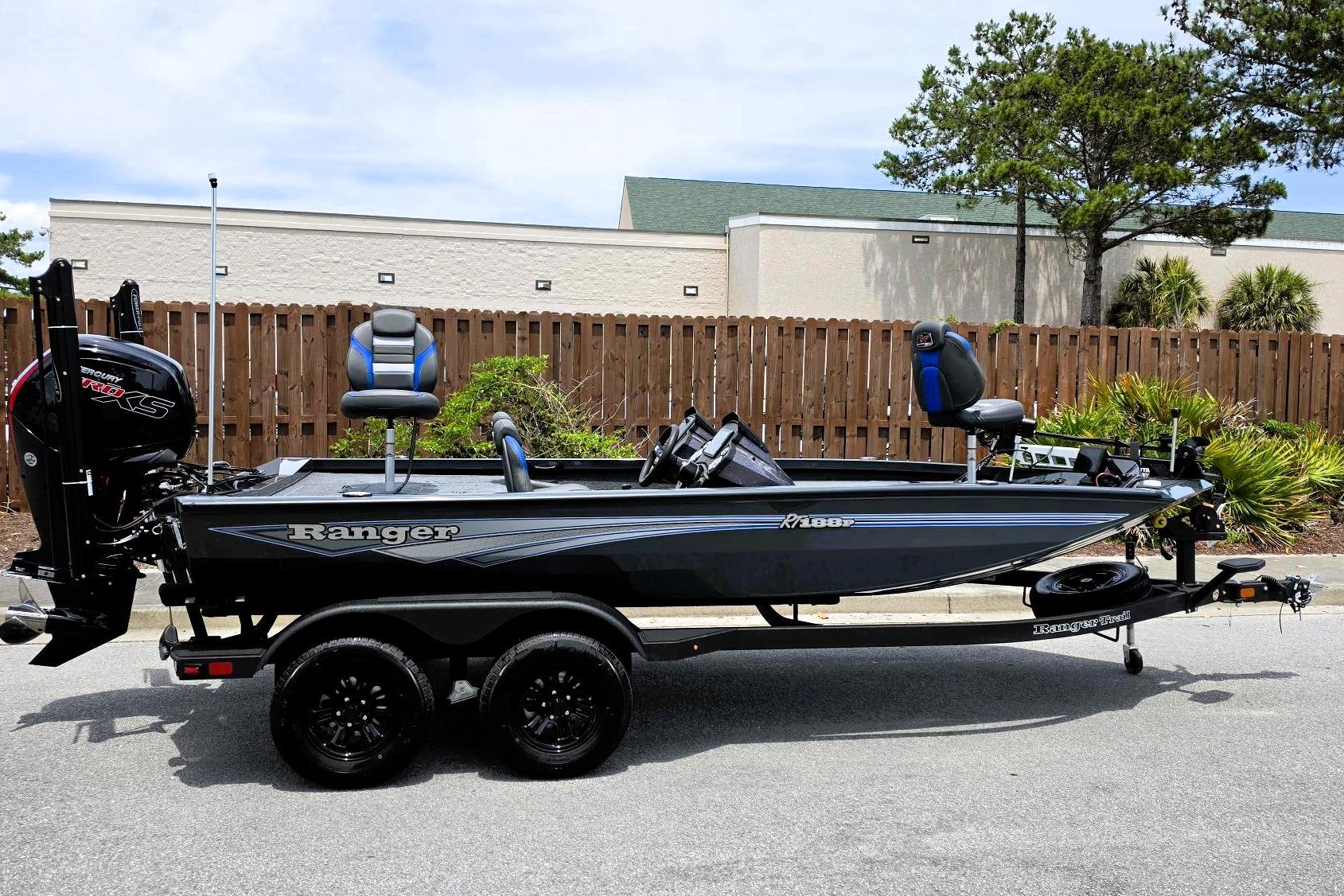 2026 Ranger RT188P fishing boat on trailer, parked outdoors, featuring sleek design and modern equipment.