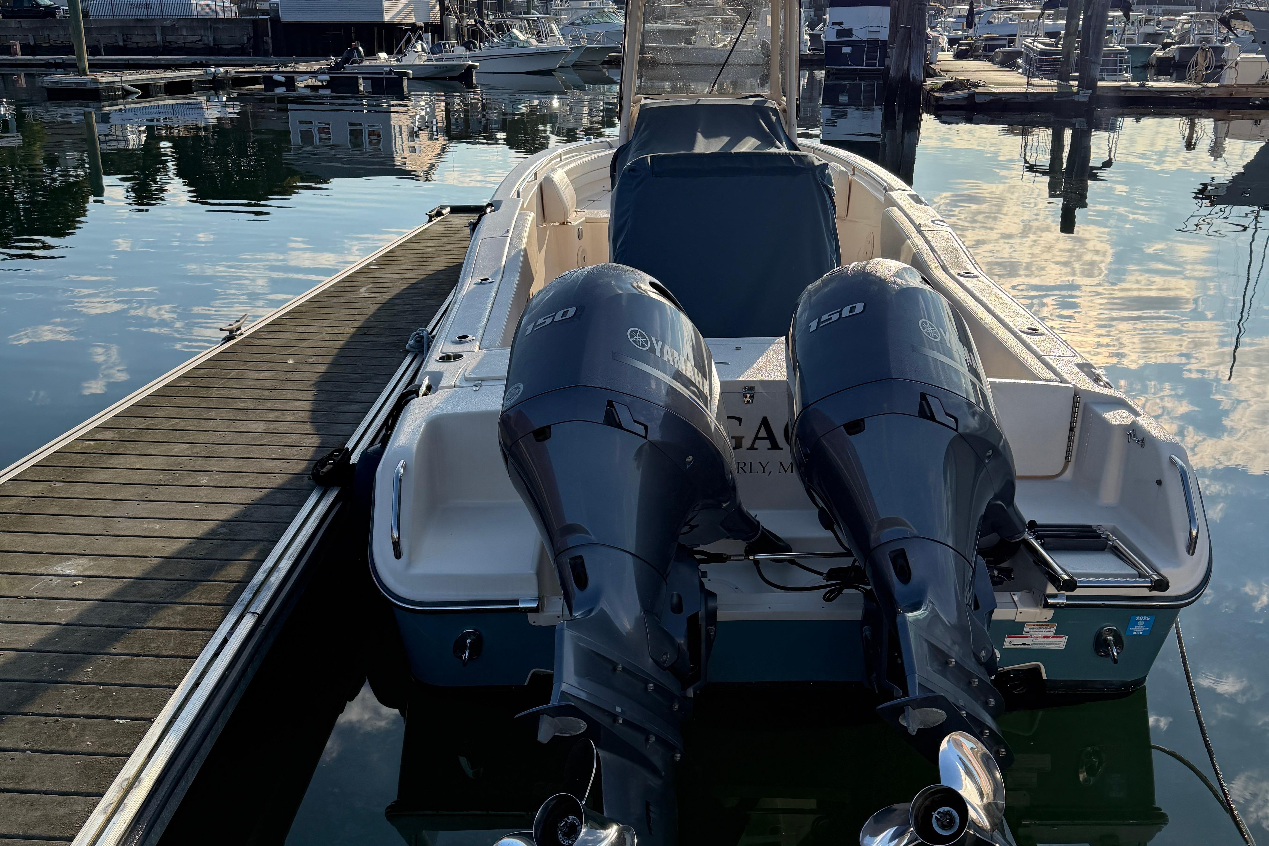 2017 Grady White 257 Fisherman boat with twin Yamaha 150 engines docked at marina.
