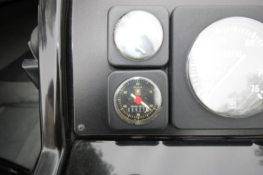 Dashboard of 1989 Formula 223 SS boat with engine hour meter and speedometer.