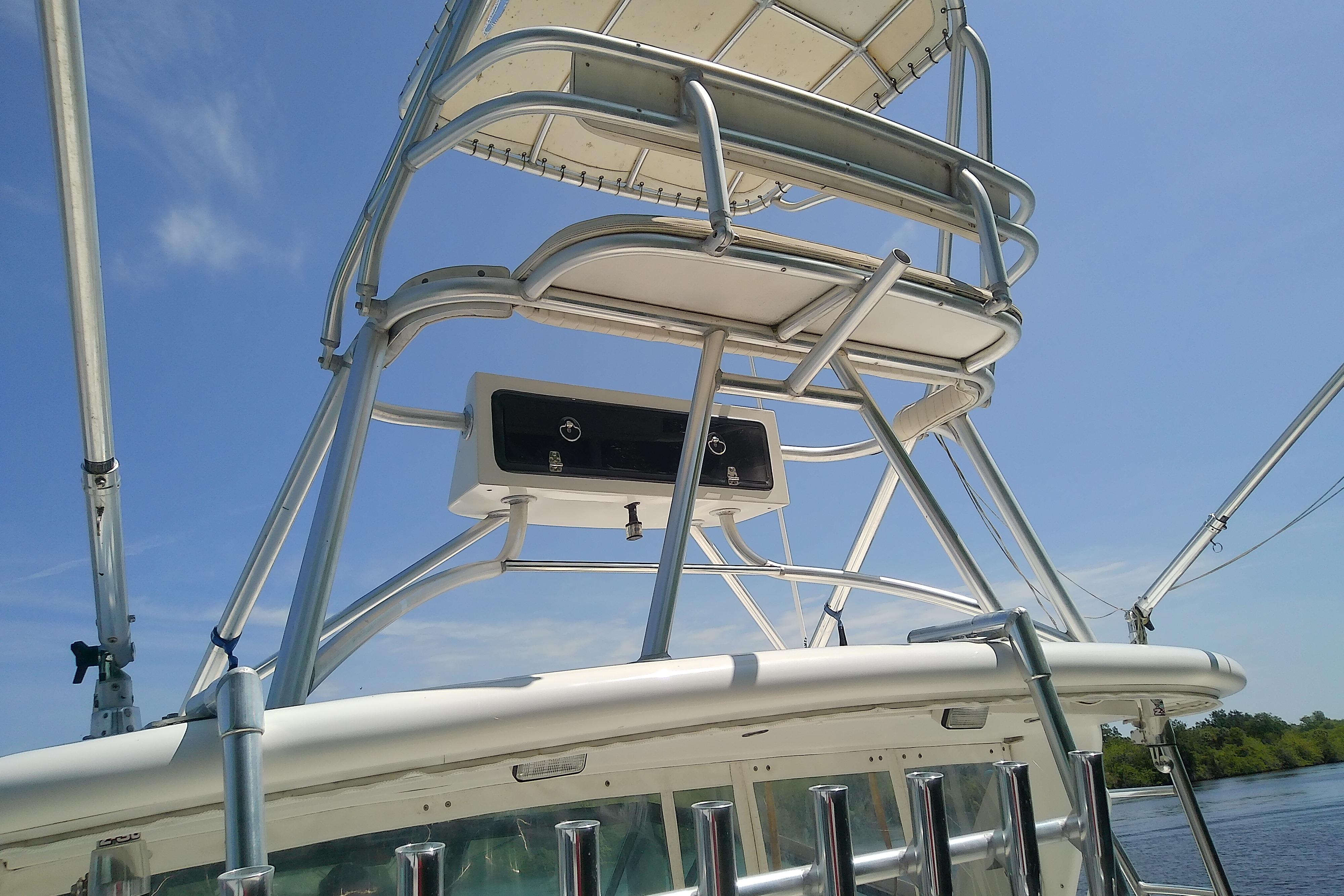 Tiara Yachts 4100 Open 2000 model with tower structure against blue sky.