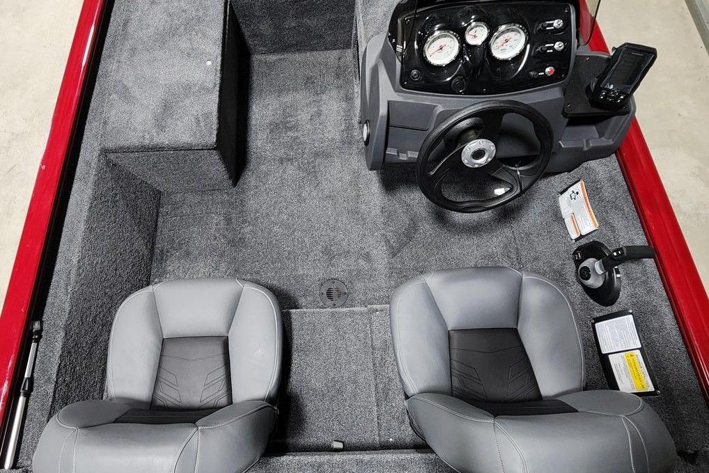 2026 Tracker Pro 170 boat interior with steering console and two gray seats.