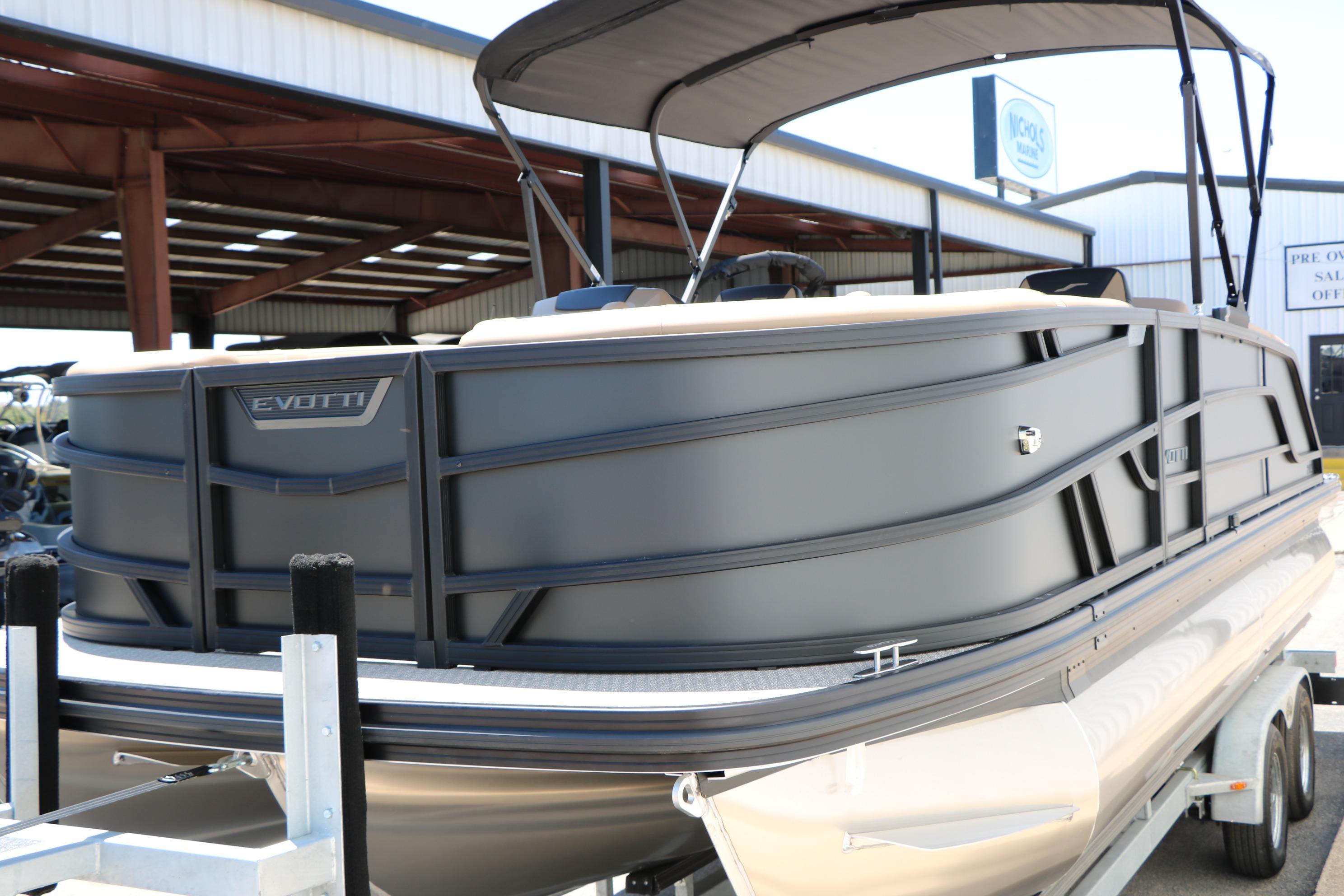 2026 Evotti 521CS pontoon boat on trailer, displayed outdoors.