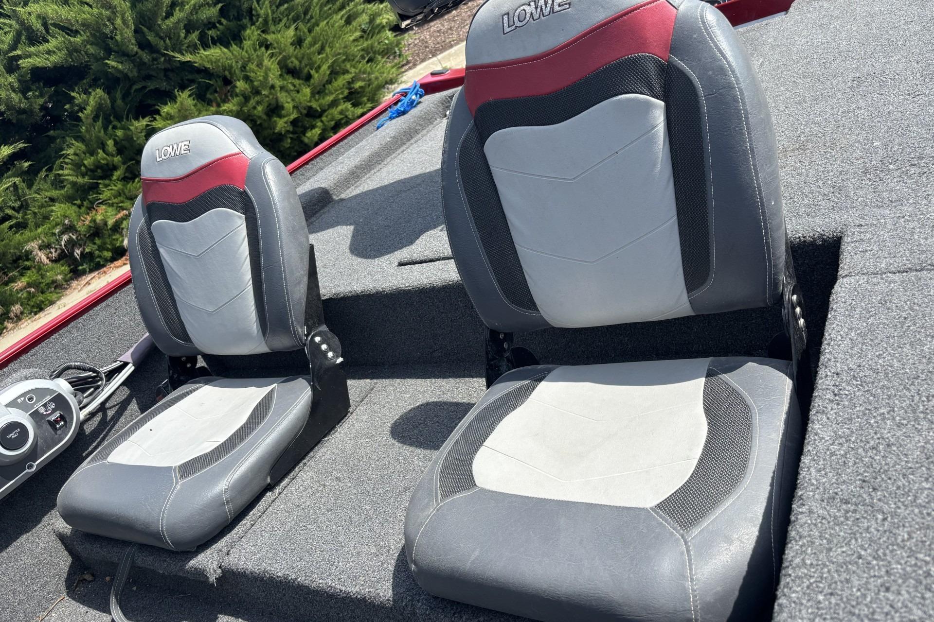 2019 Lowe Skorpion 17 boat seats with gray and red upholstery.