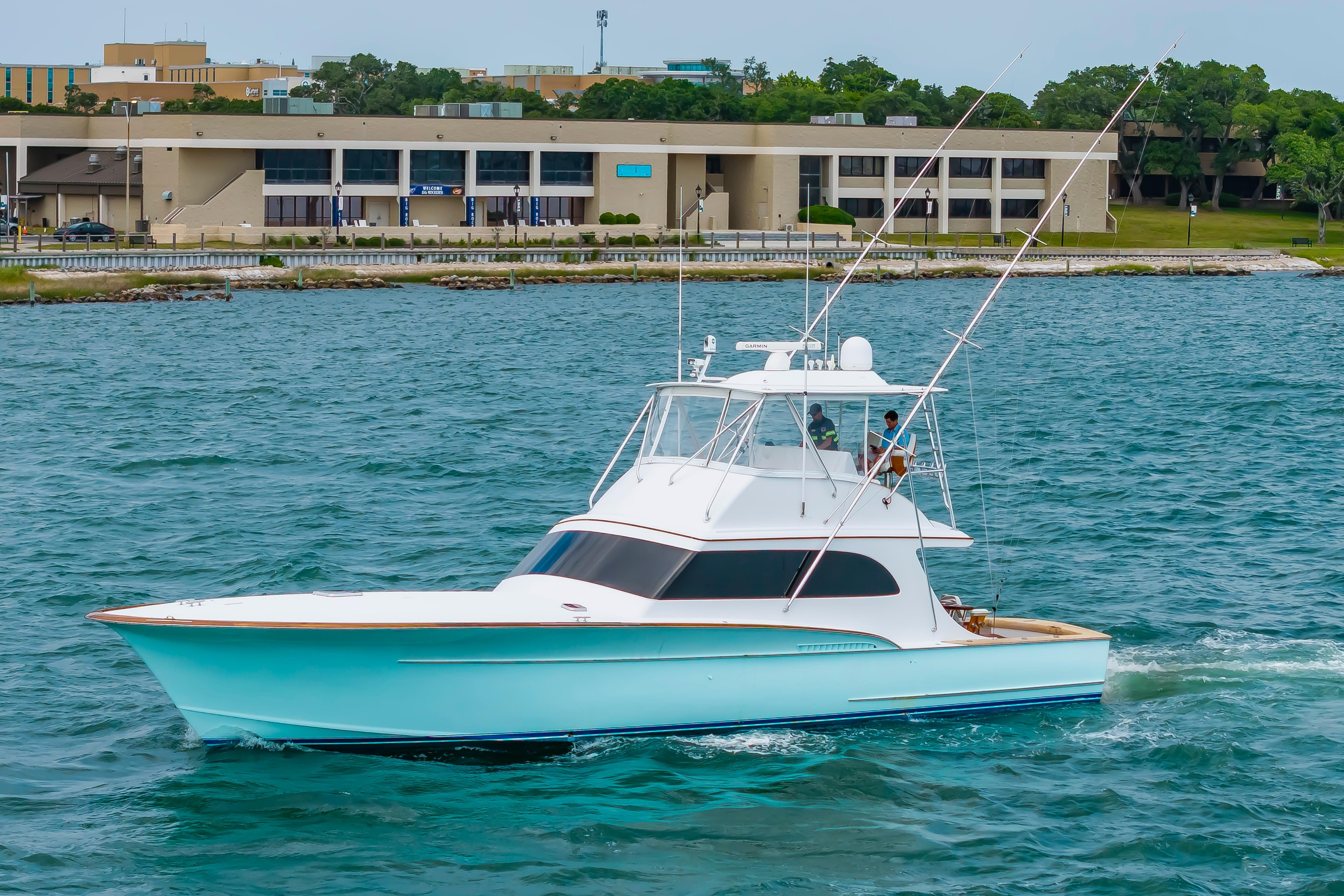 Custom Carolina Scarborough 56 Convertible yacht cruising on water, 1993 model.