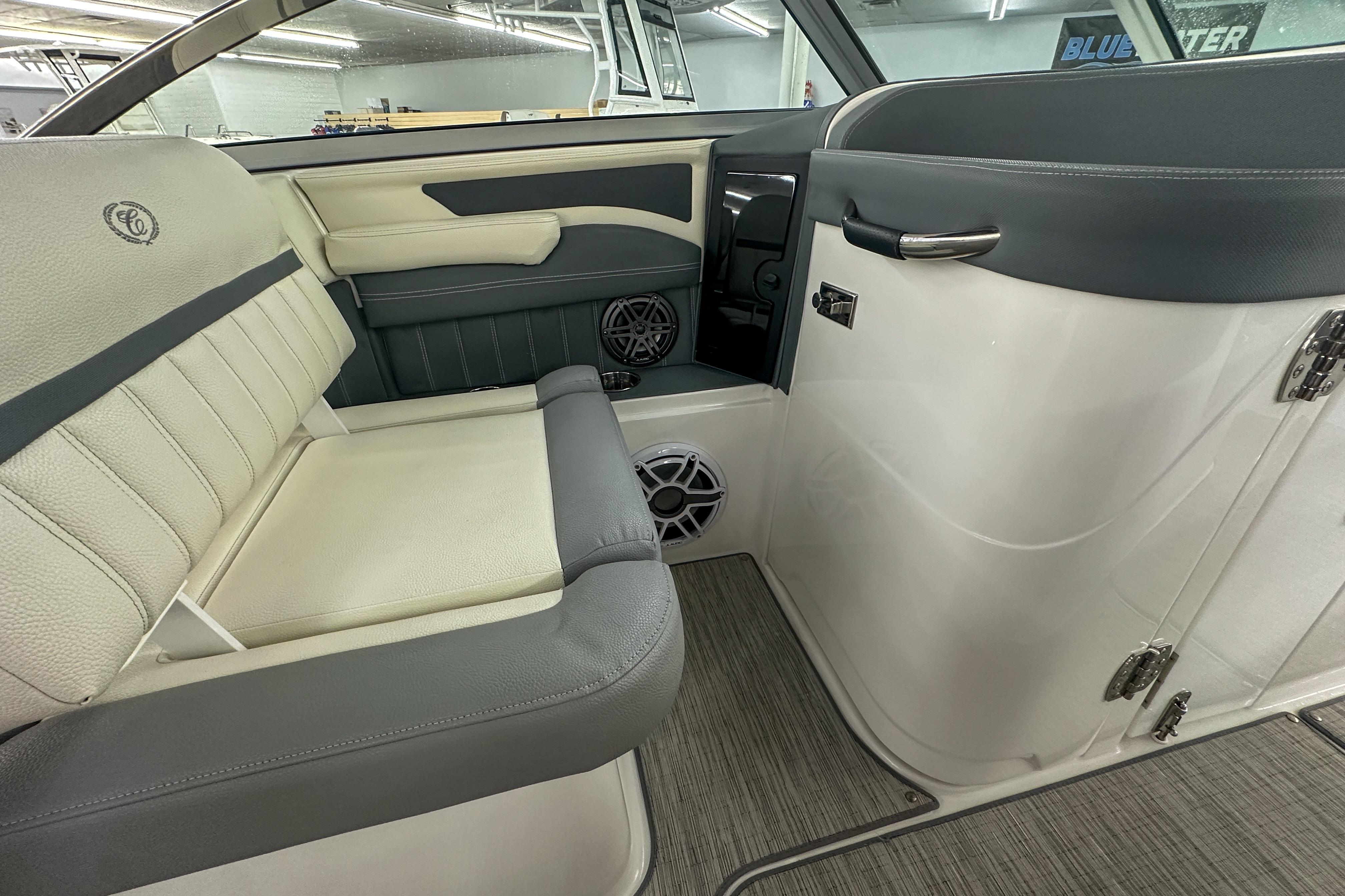 2022 Cobalt 25SC boat interior with gray and white seating, modern design.