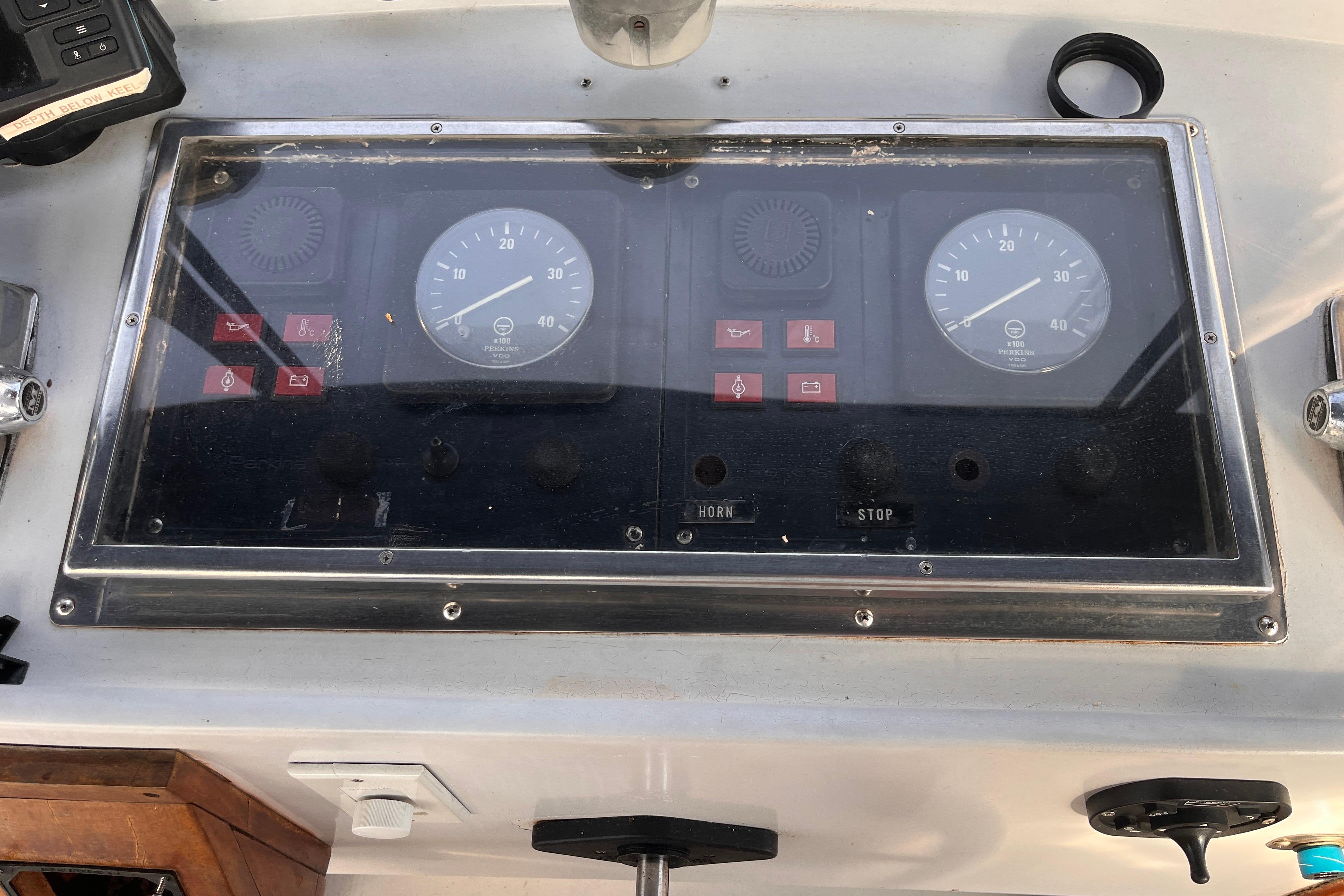 Control panel of a 1986 Jefferson 42 SE Sundeck Motor Yacht with gauges and switches.
