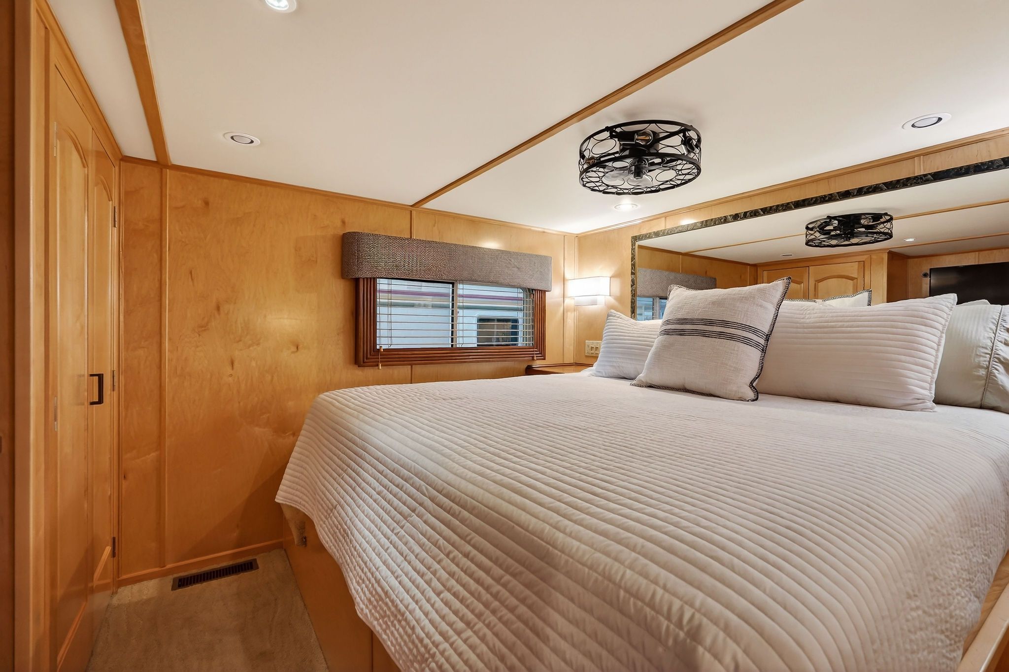 Cozy bedroom on a 2010 Houseboat Throughbred.
