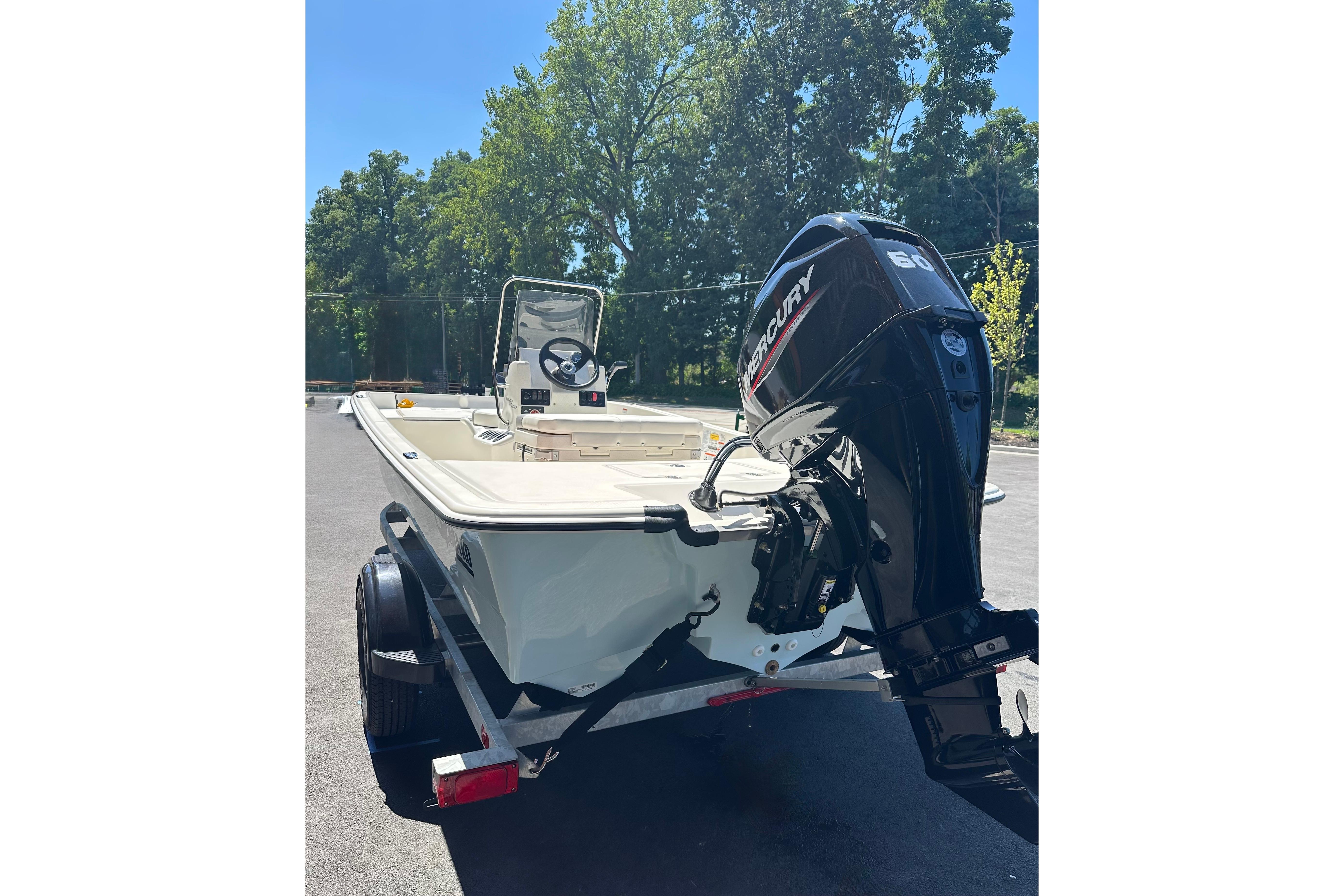 2026 Mako Pro Skiff 17 CC boat with Mercury outboard motor on trailer.