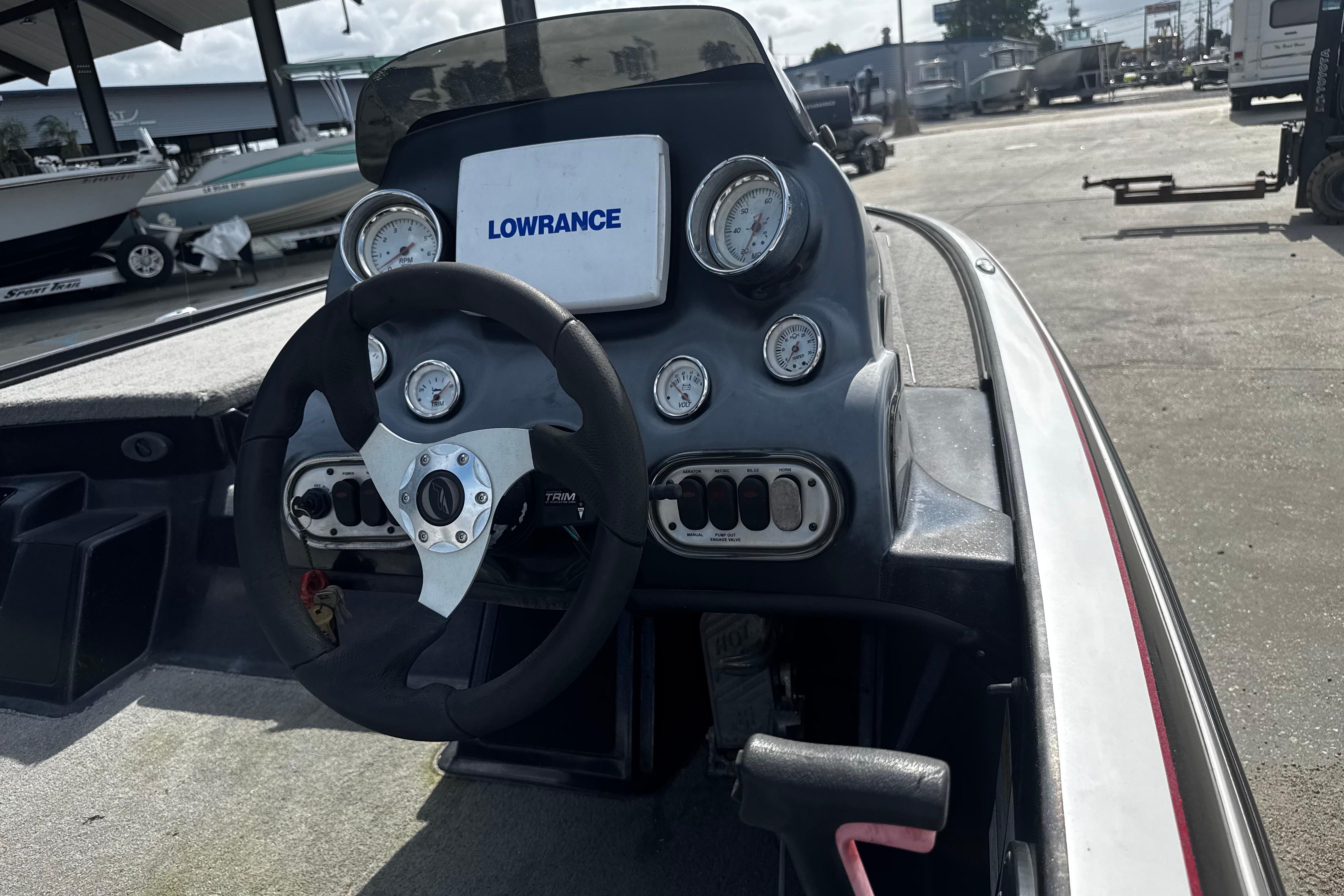 Steering console of a 2012 Nitro Z-7 boat with Lowrance display and gauges.