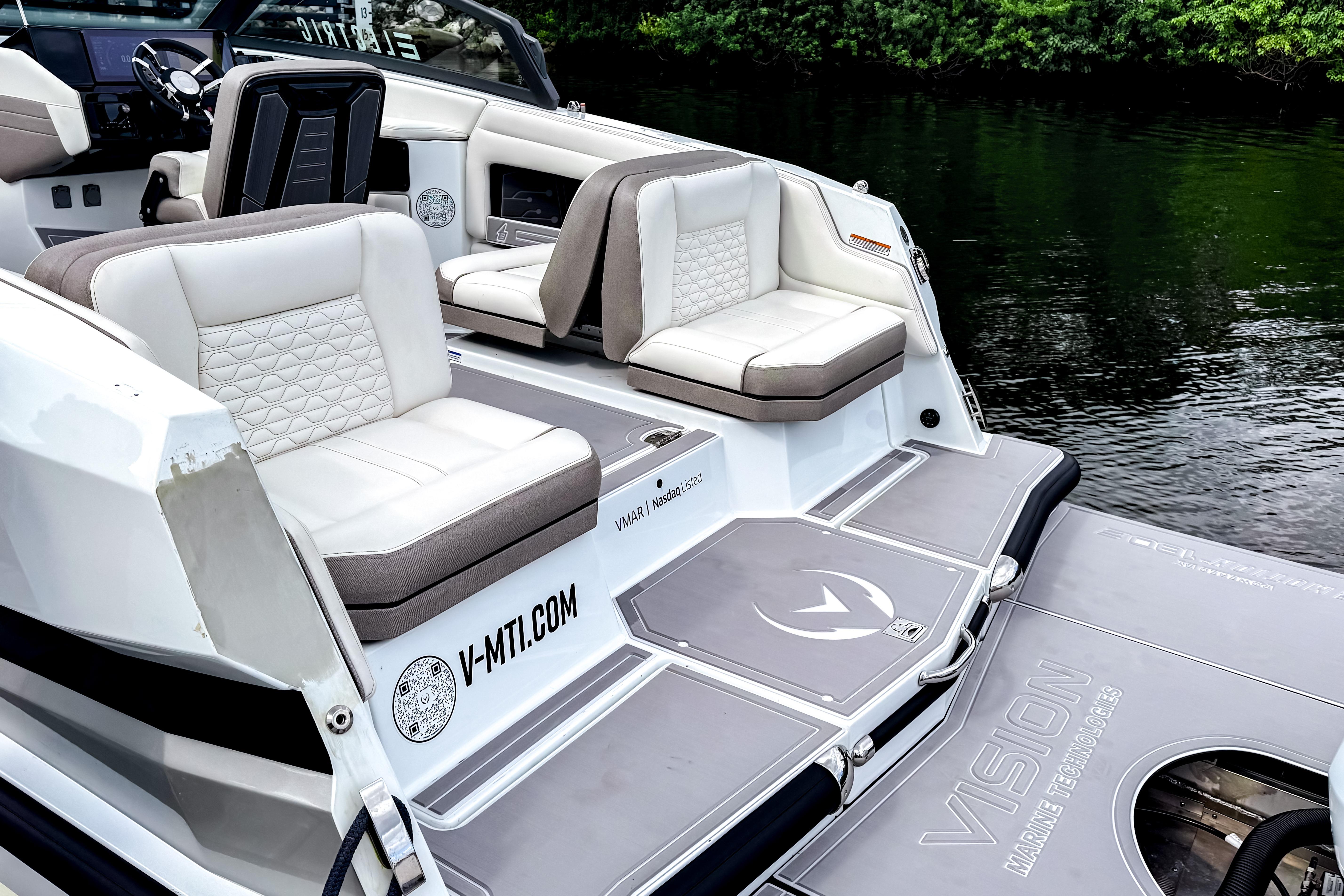 Luxury seating on 2026 Ingenity EL boat, featuring modern design and waterfront view.
