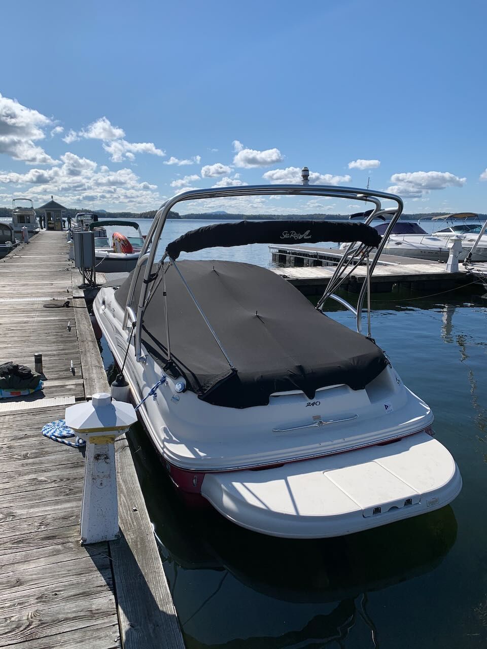 2005 Sea Ray 240 Sundeck docked on a sunny day.