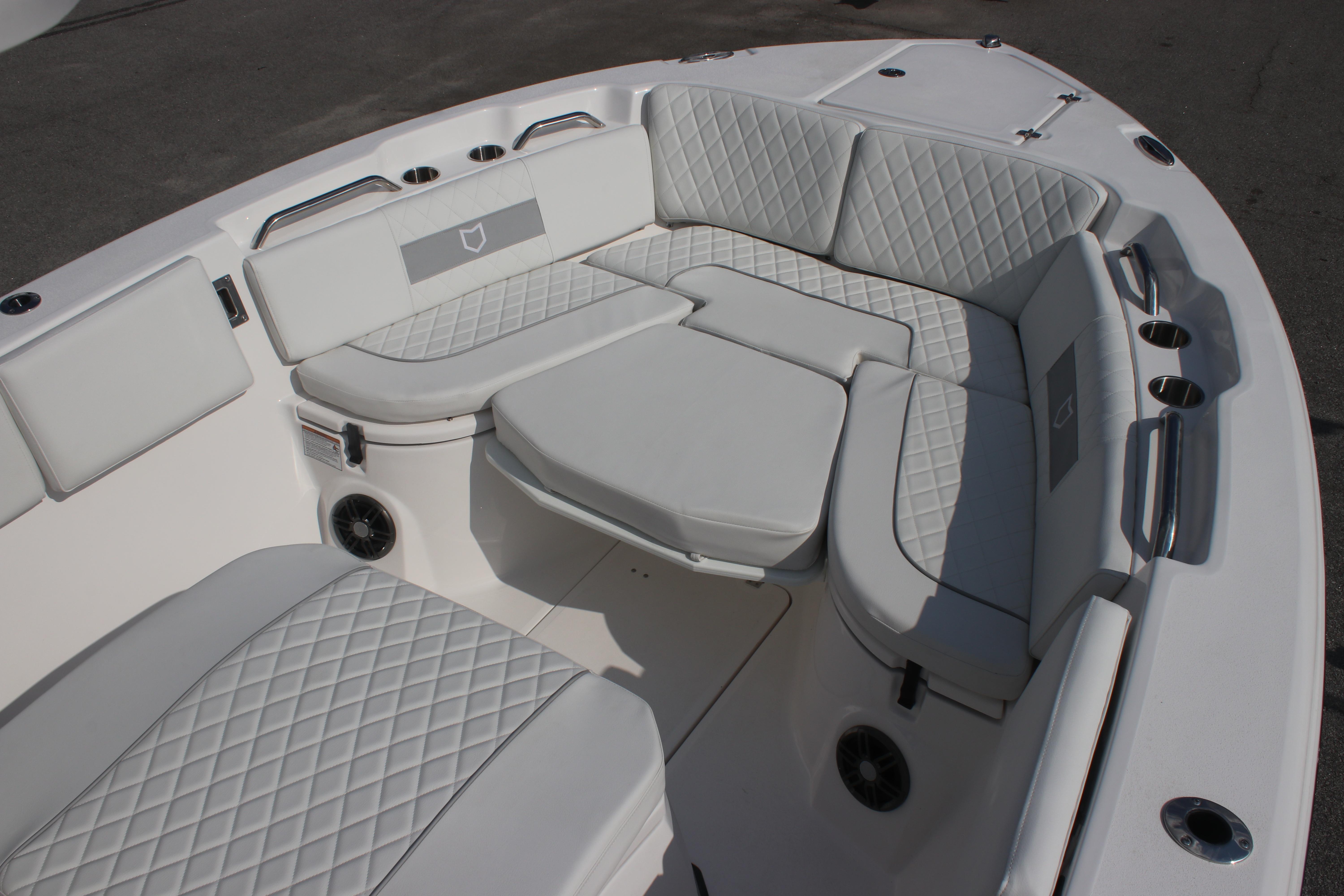Luxurious seating area on 2026 Sea Fox 268 Commander boat with quilted upholstery.
