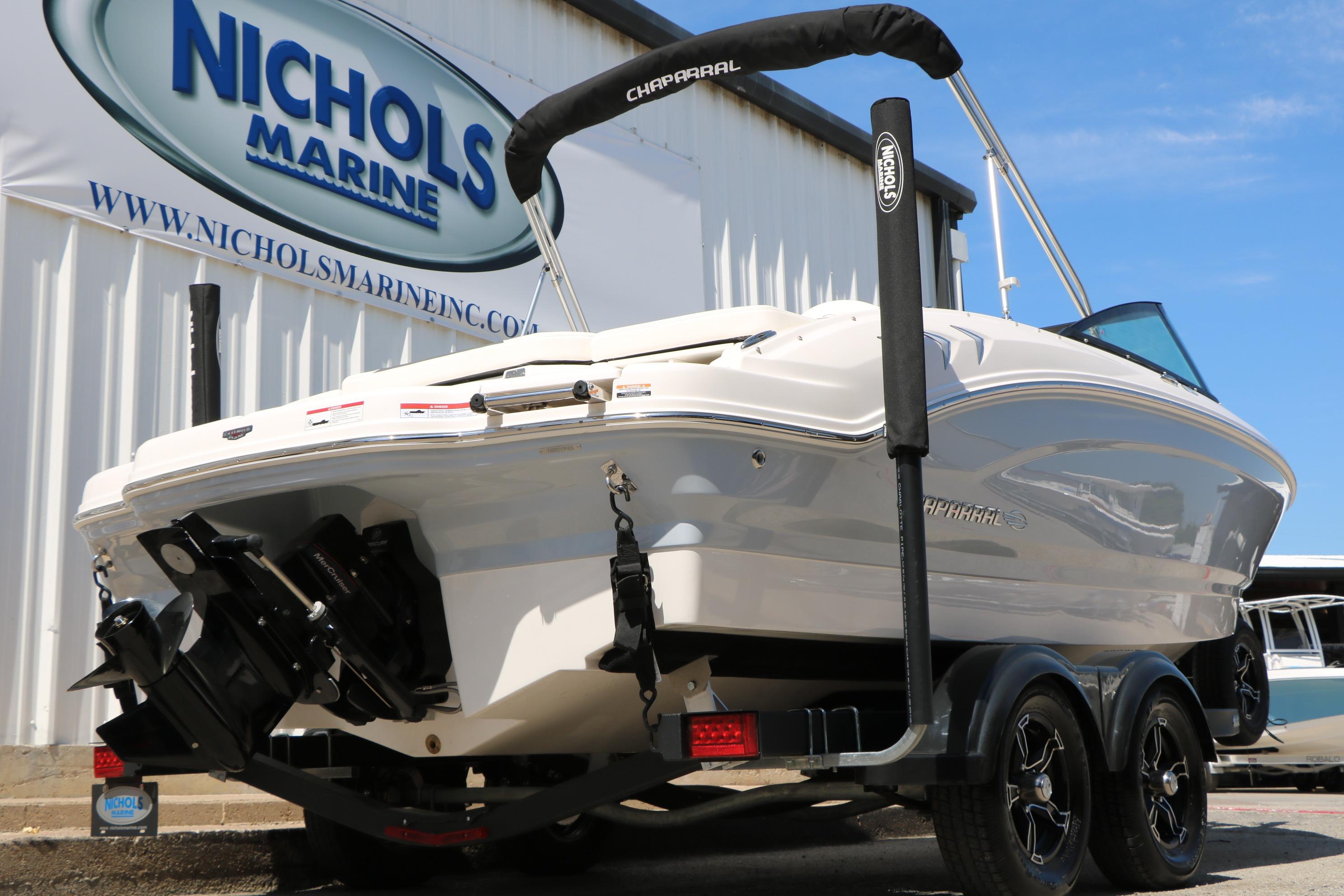 2025 Chaparral 21 SSi Ski & Fish boat on trailer at Nichols Marine dealership.