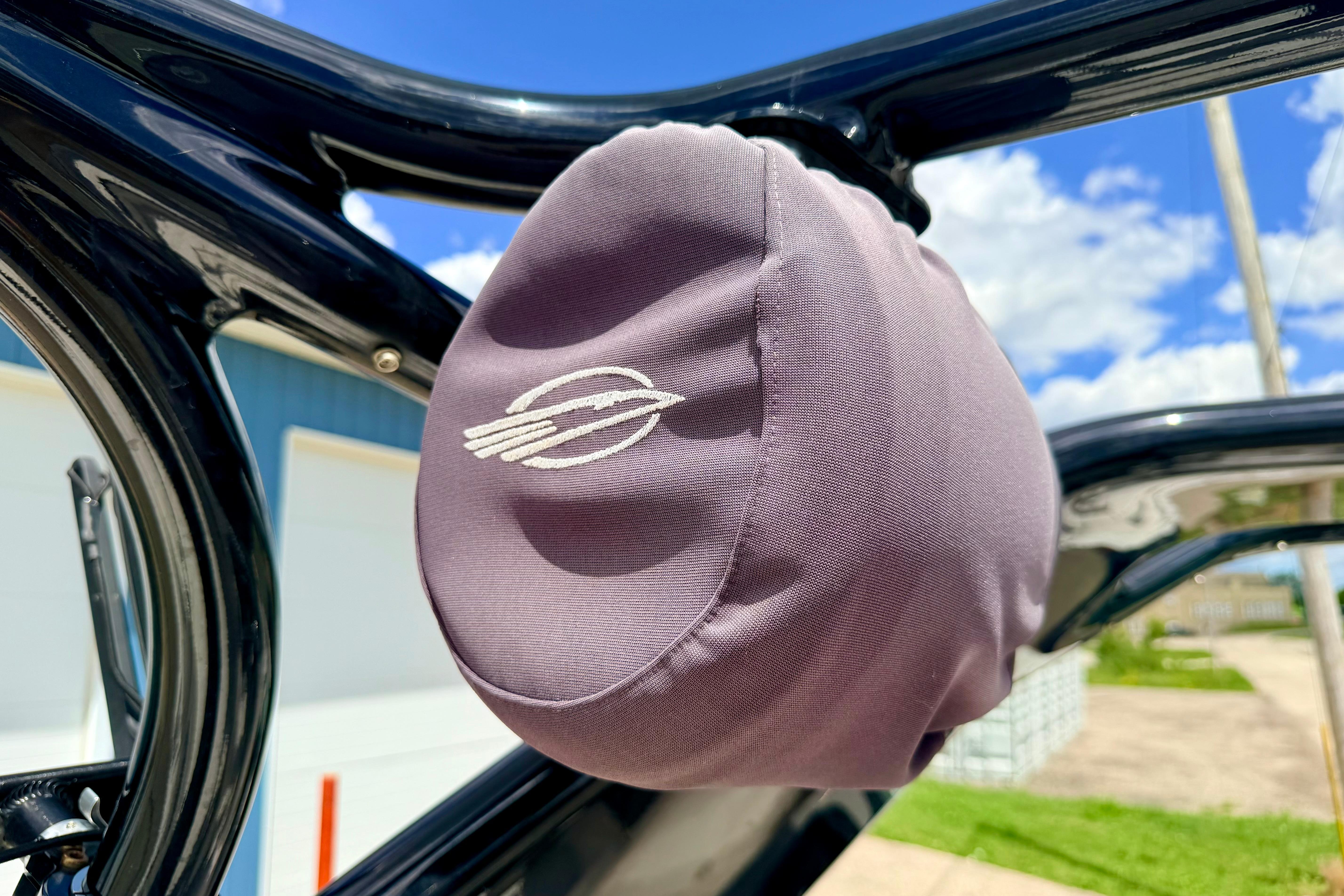 Protective cover on Chaparral Sunesta 264 boat, 2015 model, under sunny sky.