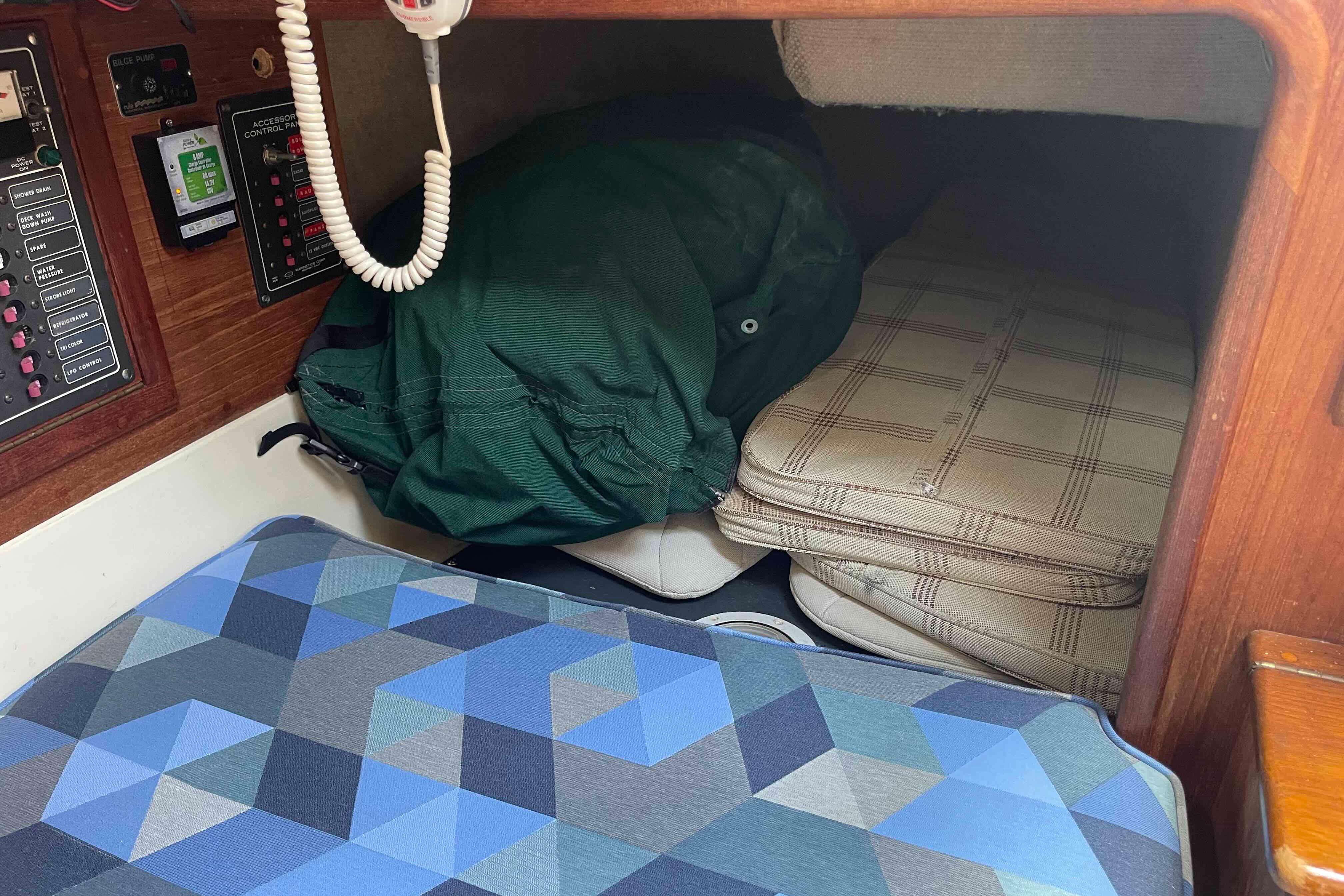 Interior of 1987 Pacific Seacraft 34 sailboat with cushions and control panels.