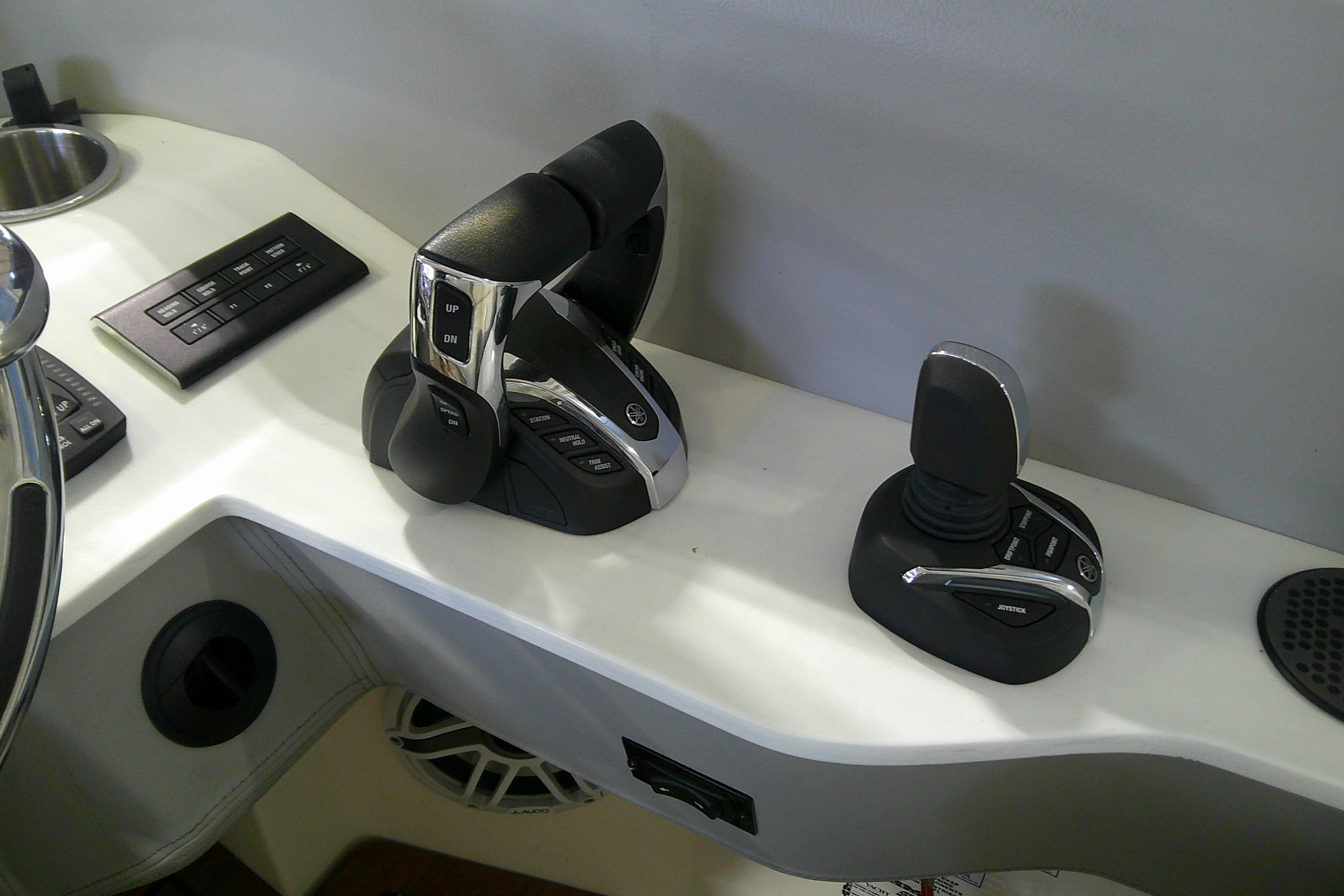 Control panel of 2023 Regal LX36 boat with joystick and throttle controls.