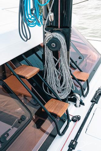 Nautitech 40 Open 2025 yacht with ropes and wooden steps on deck.