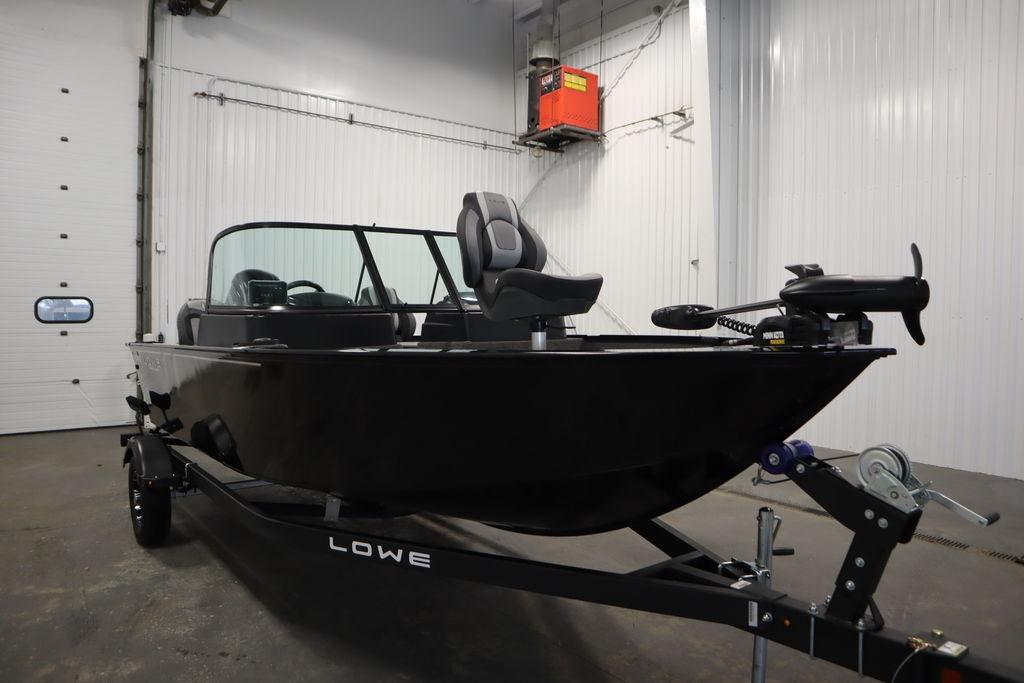 2026 Lowe Fishing Machine 175 boat in a garage setting.