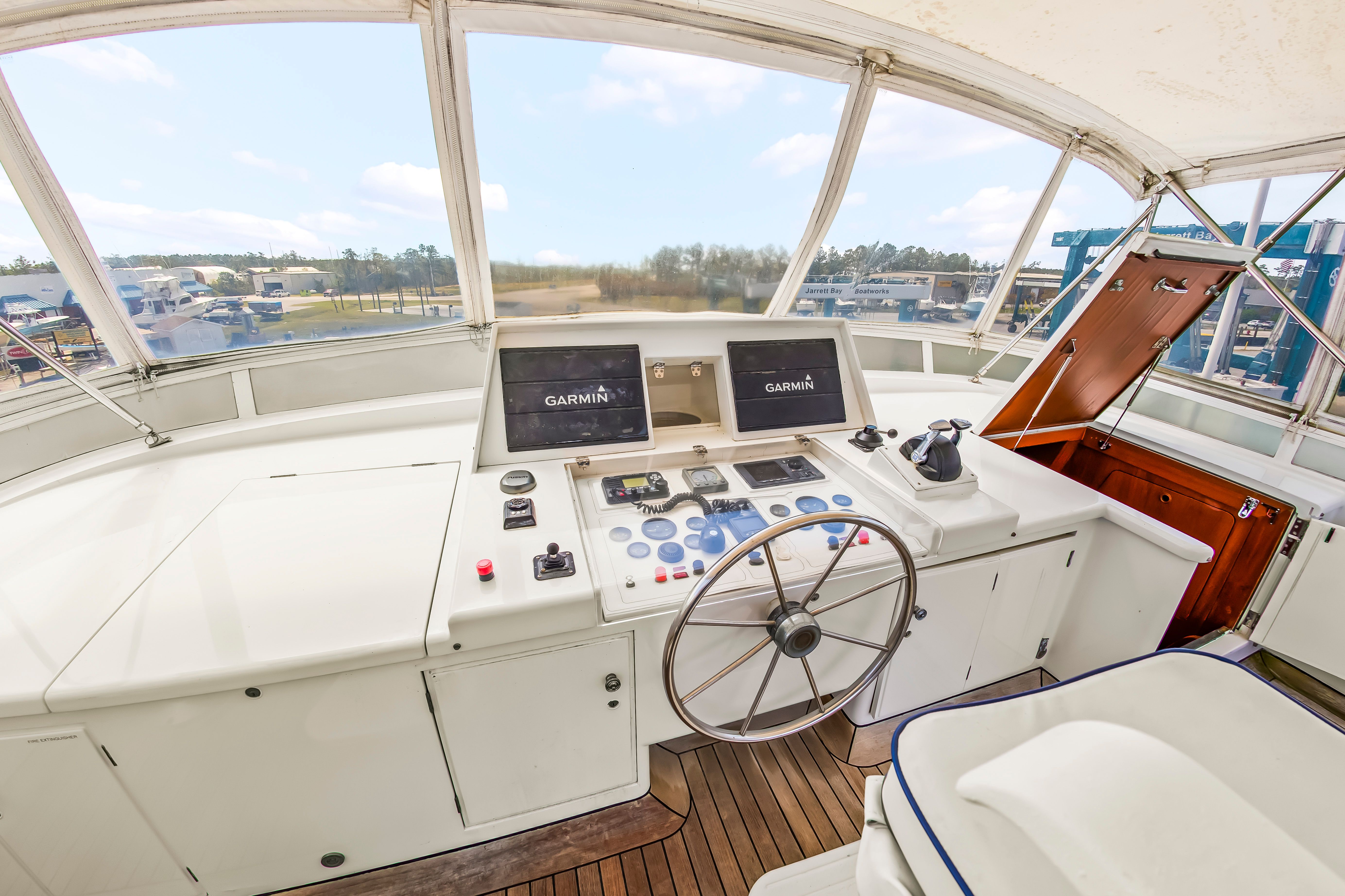 The helm of a 1987 Jongert 78 Motor Yacht with modern navigation systems.