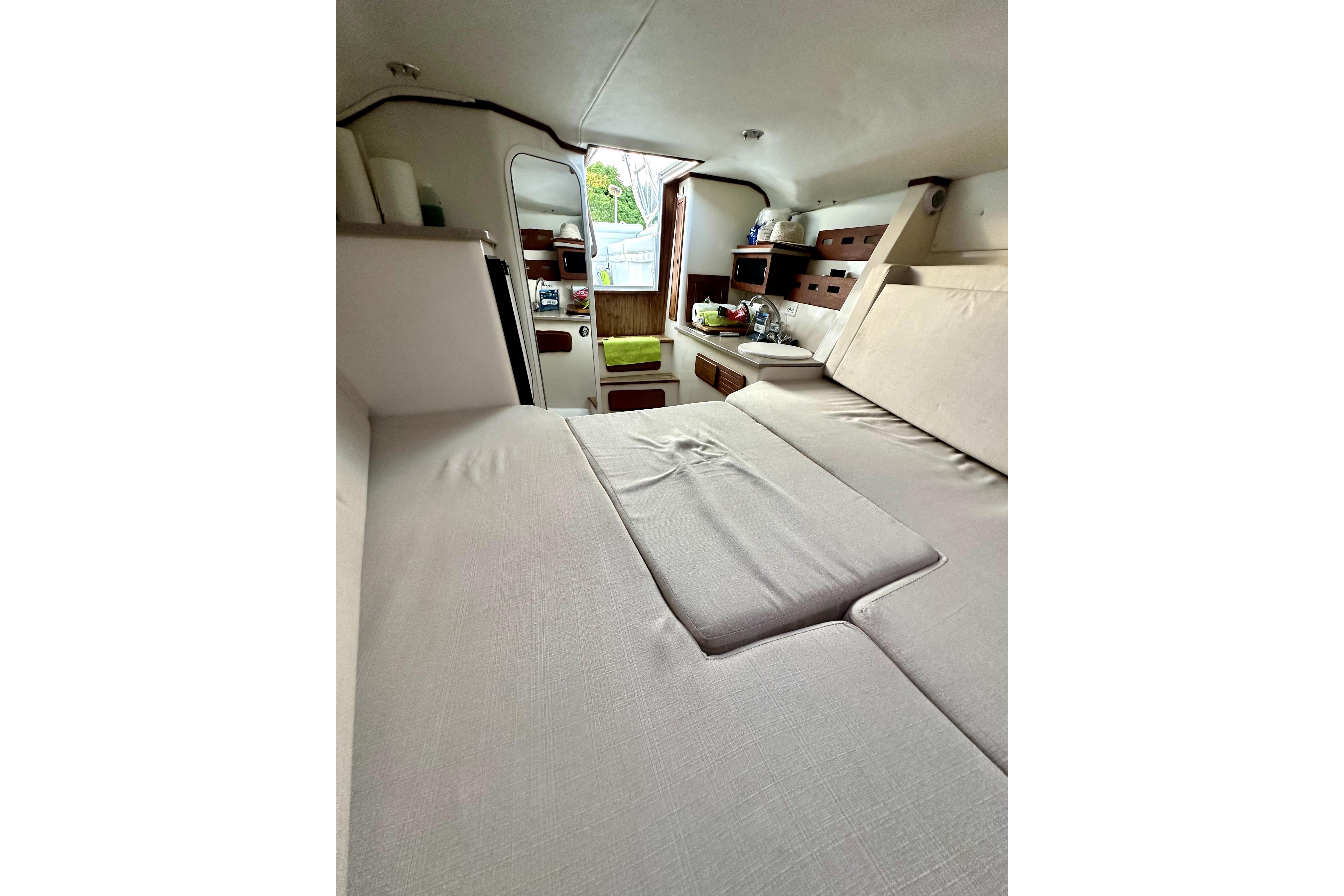 2006 Contender 35 Express Side Console cabin interior with cozy seating and storage.