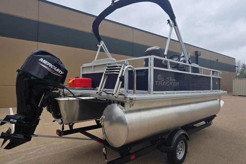 2026 Sun Tracker Bass Buggy 16 XL Select pontoon boat with Mercury outboard motor.