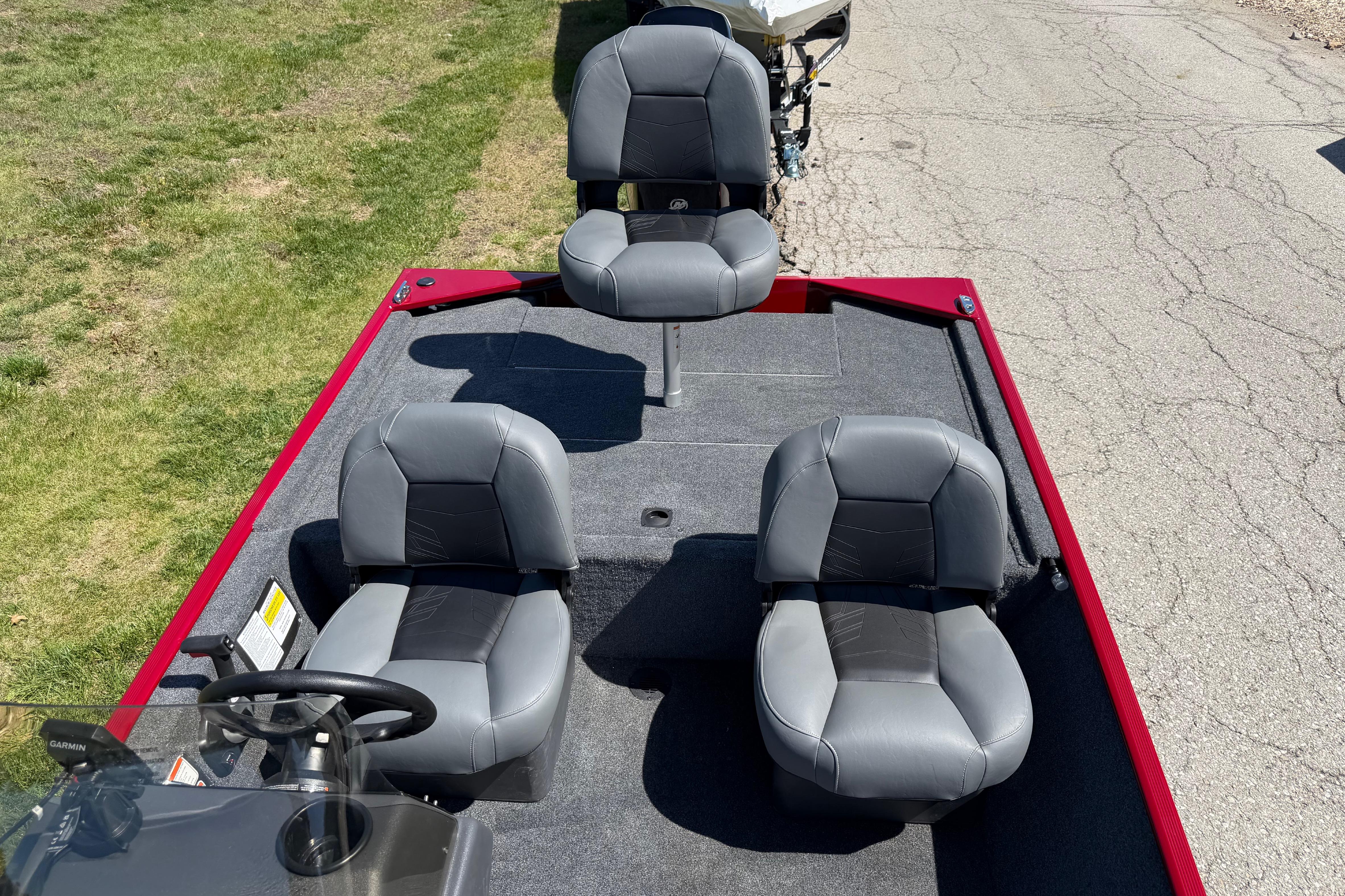 2026 Tracker Bass Tracker Classic XL boat interior with three gray seats.