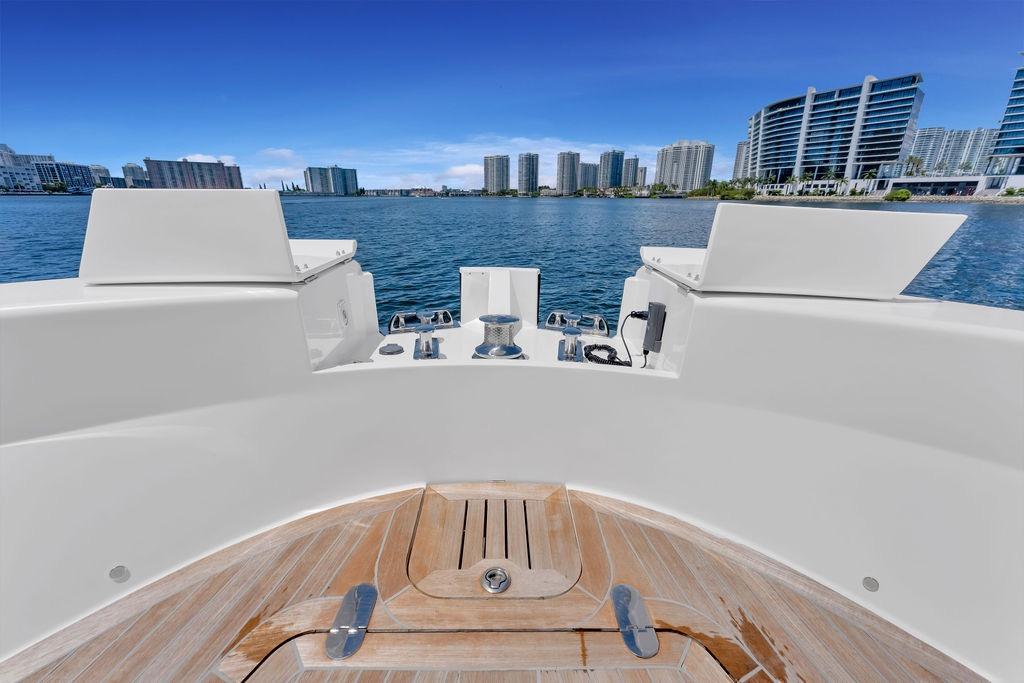 2021 Bluegame BG 42 yacht deck with city skyline and waterfront view.