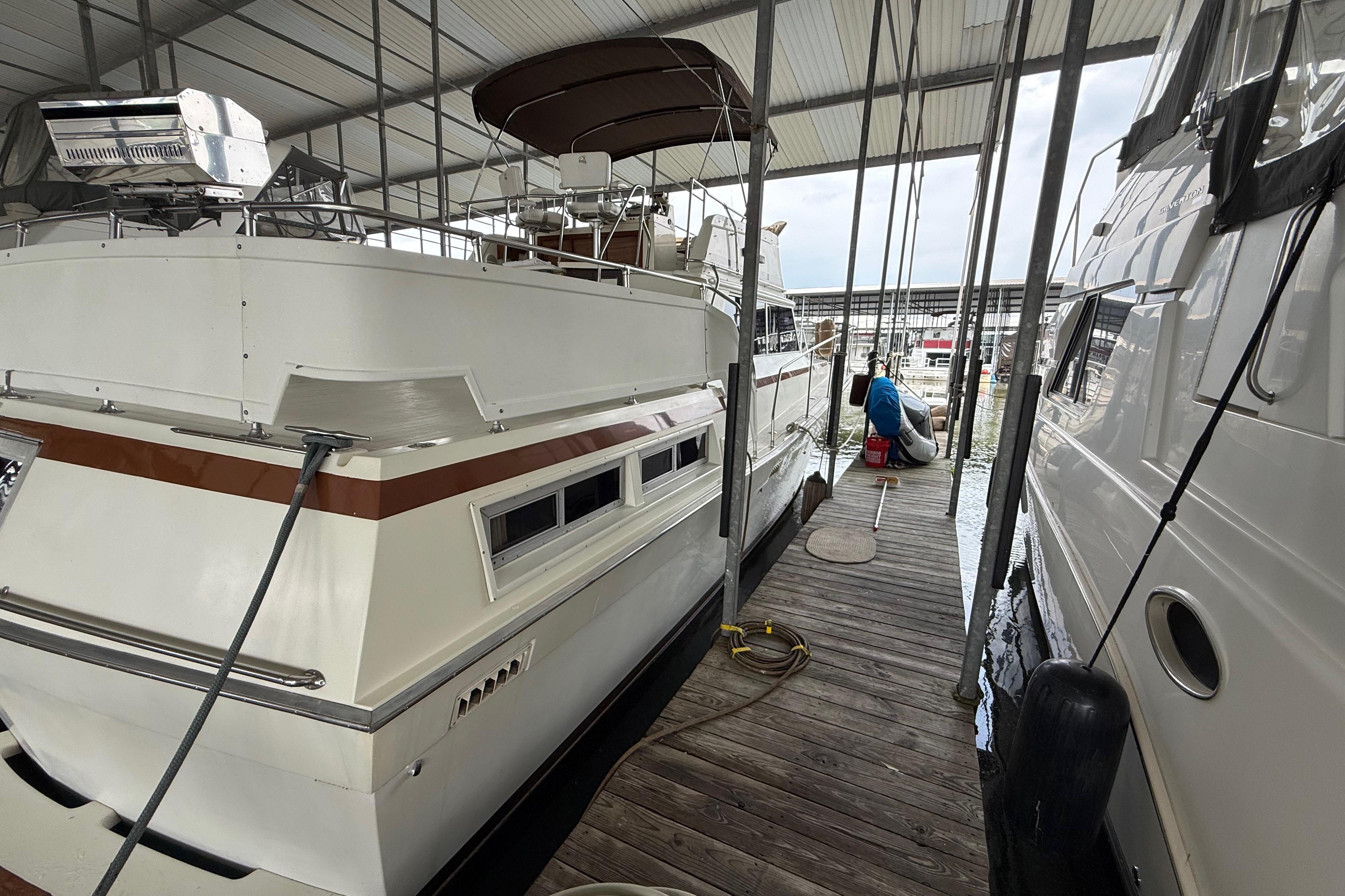 1979 Viking 43 Double Cabin yacht docked in a covered marina.