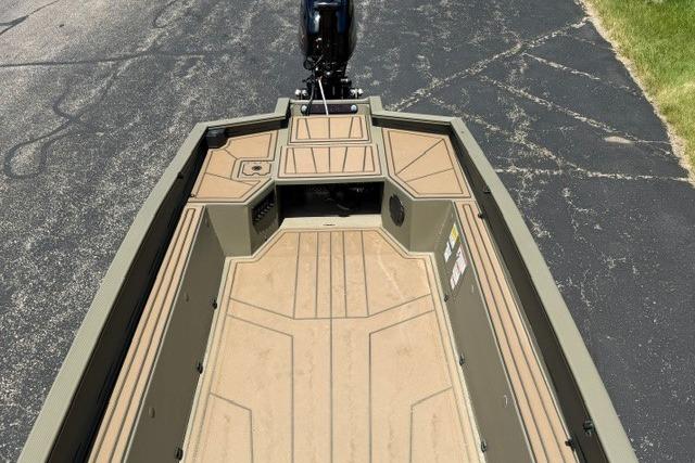 2026 Tracker Grizzly 1650 T Prairie Wings Edition boat interior, featuring spacious deck and storage.