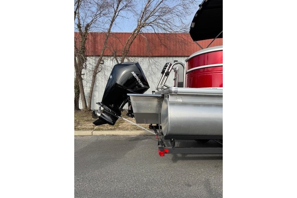 2026 Sun Tracker Party Barge 24 XP3 with Mercury outboard motor, parked outdoors.