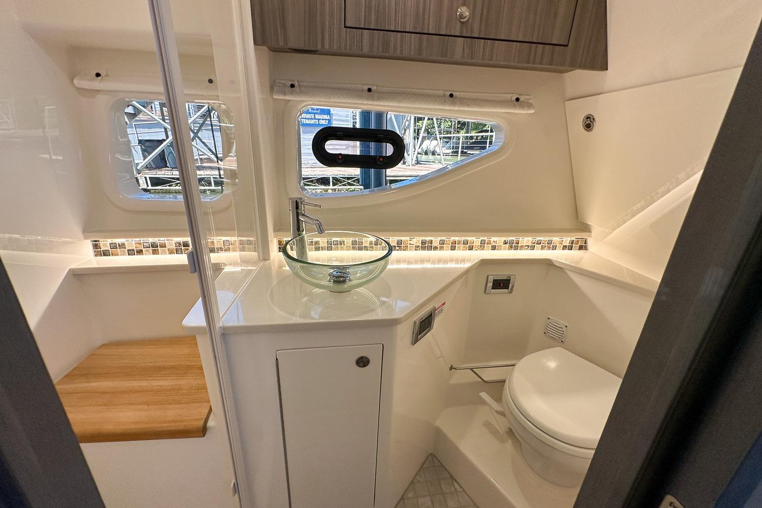 Luxurious bathroom interior of 2025 Sea Ray Sundancer 370 yacht with modern fixtures.