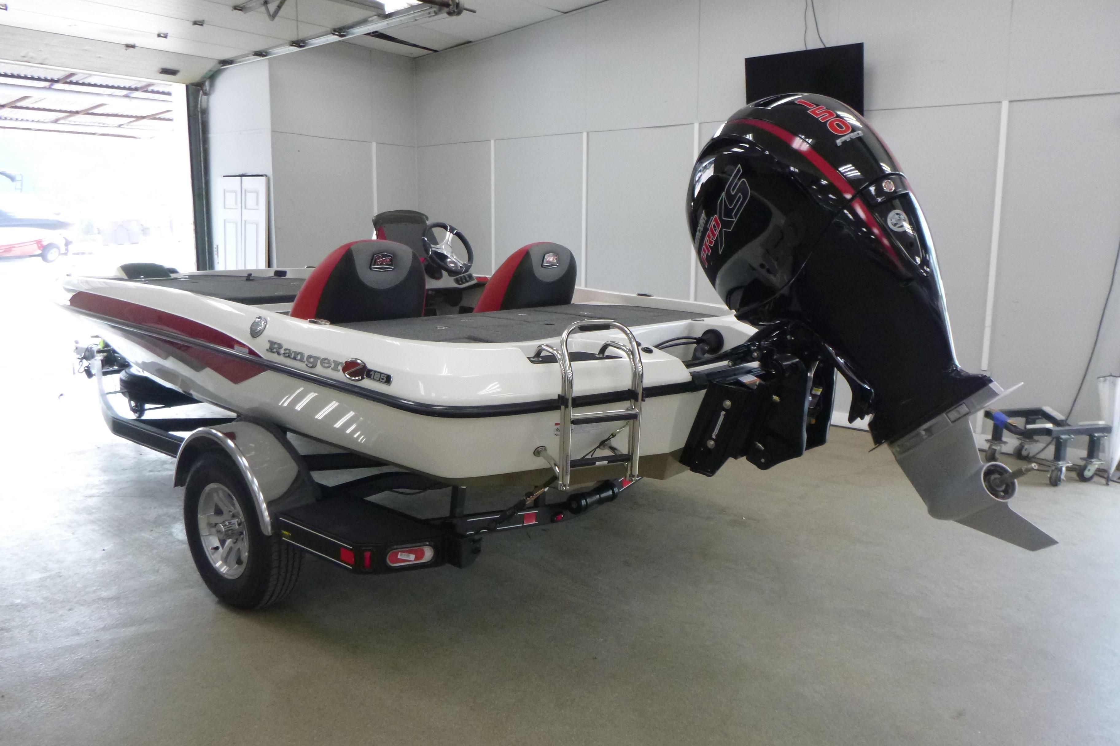 2025 Ranger Z185 boat with powerful outboard motor in a garage setting.