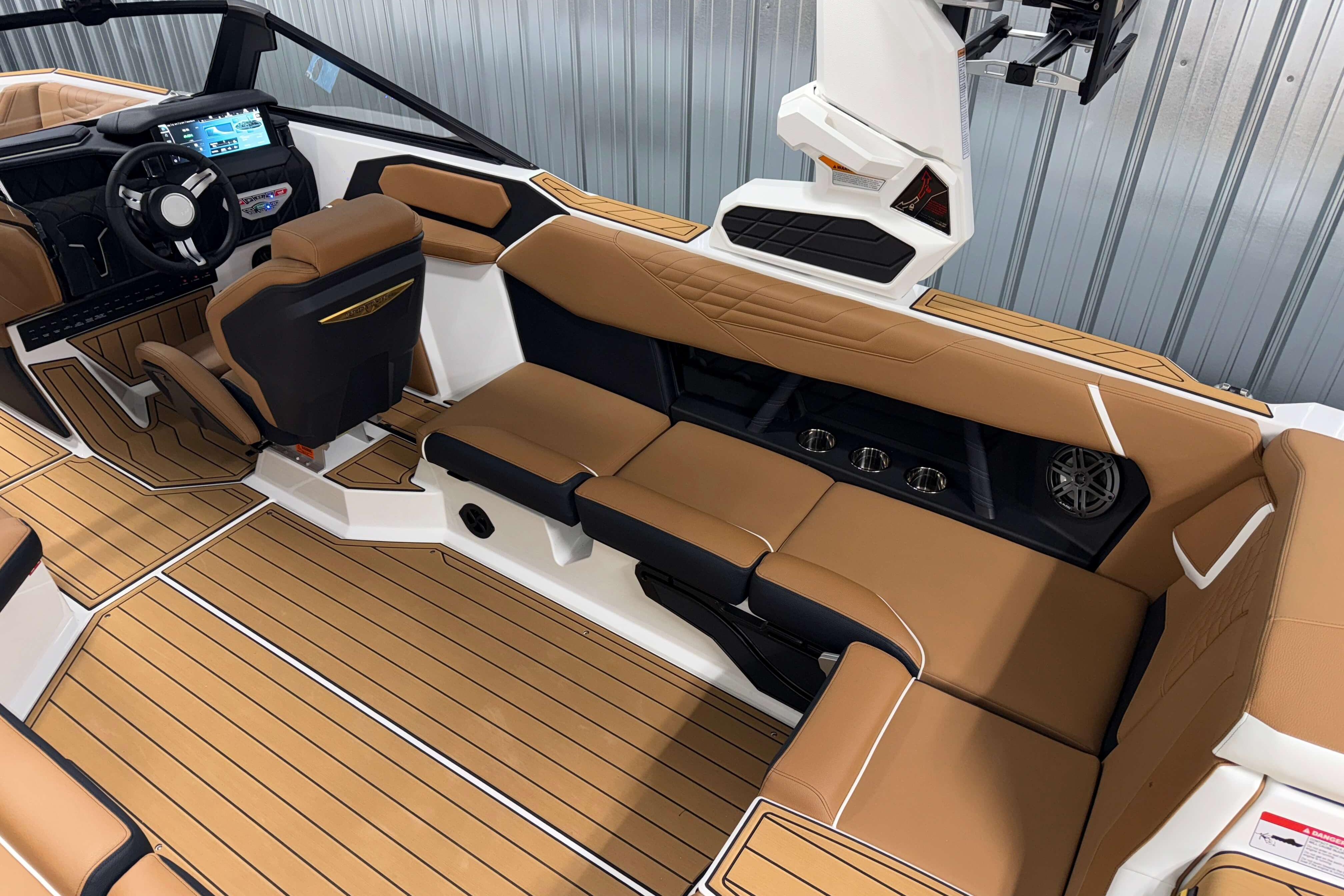 2026 Nautique Super Air Nautique S23 interior with tan seating and modern dashboard.
