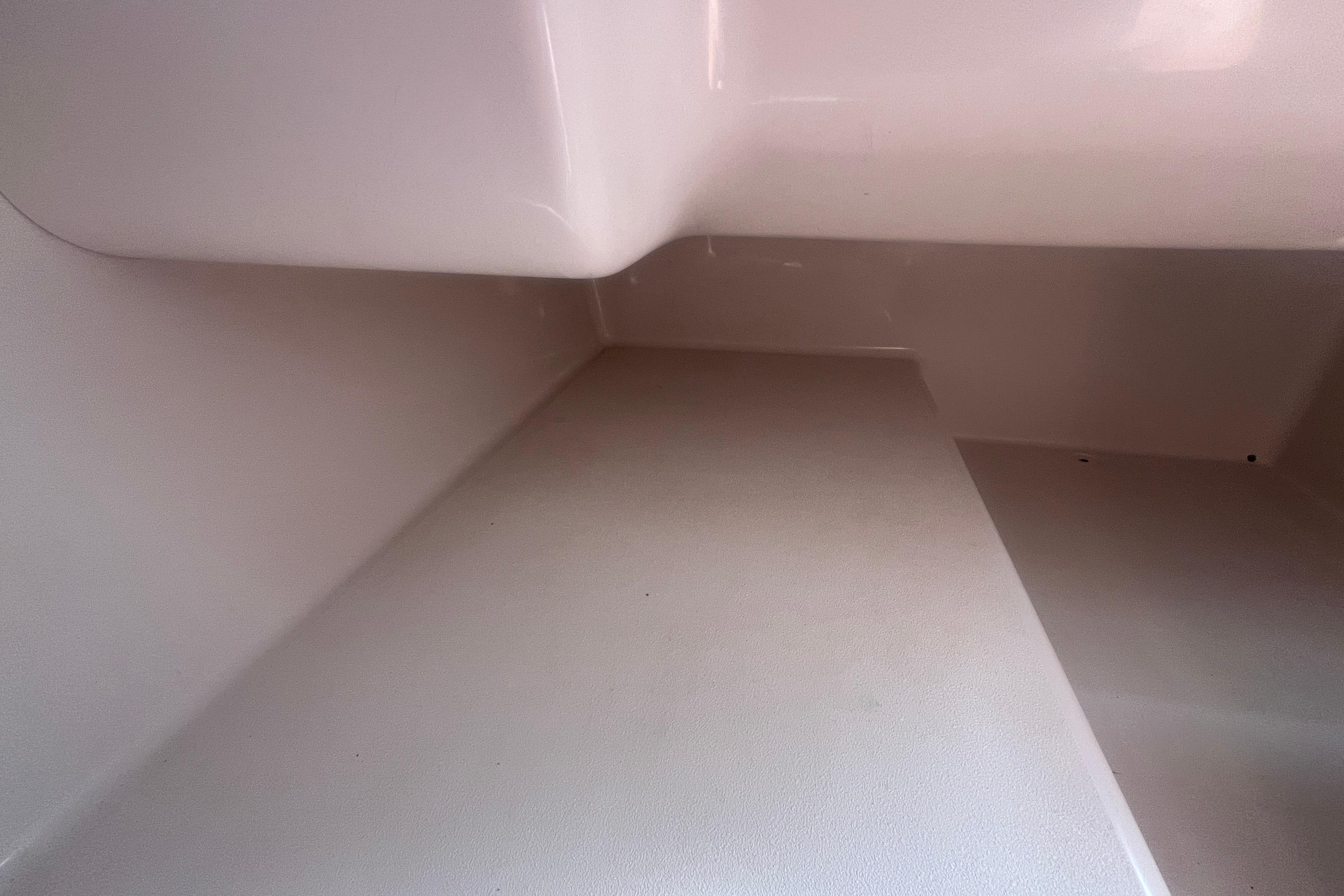 Interior view of a 2002 Hurricane SunDeck 260 OB boat compartment.