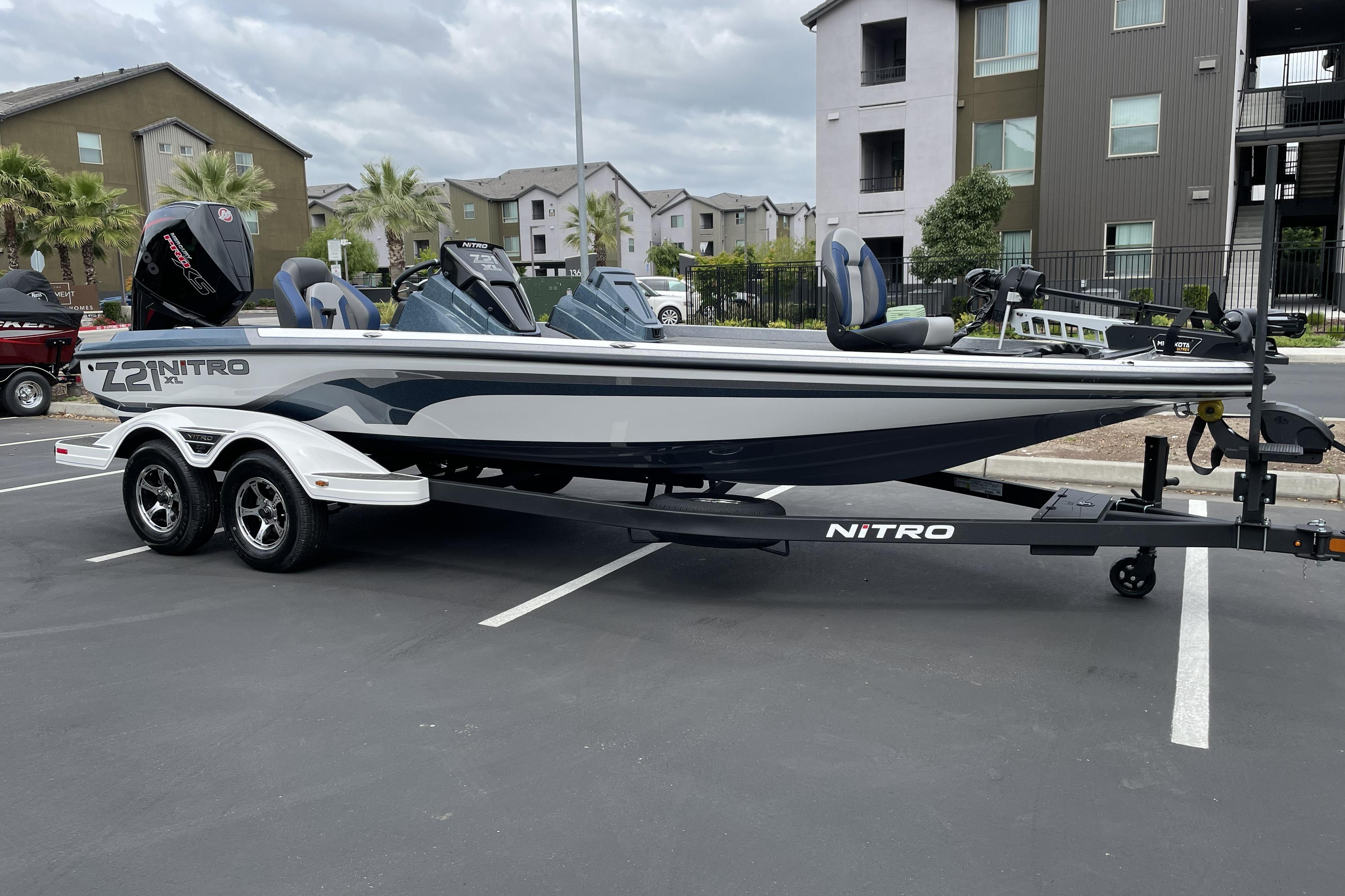 2026 Nitro Z21 XL boat parked in a residential area, showcasing sleek design.
