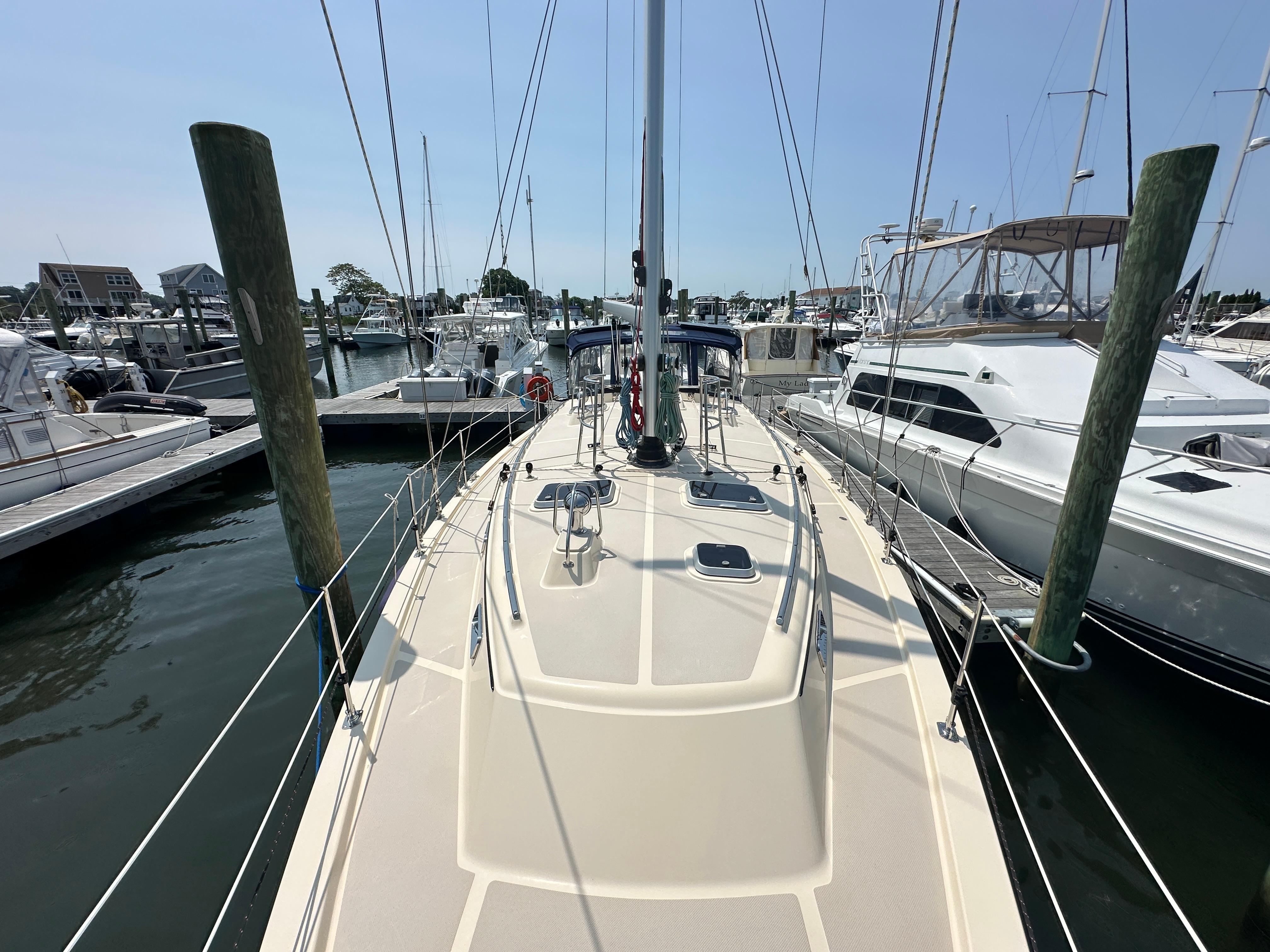 Island Packet 439 sailboat docked at marina, 2021 model, sunny day.