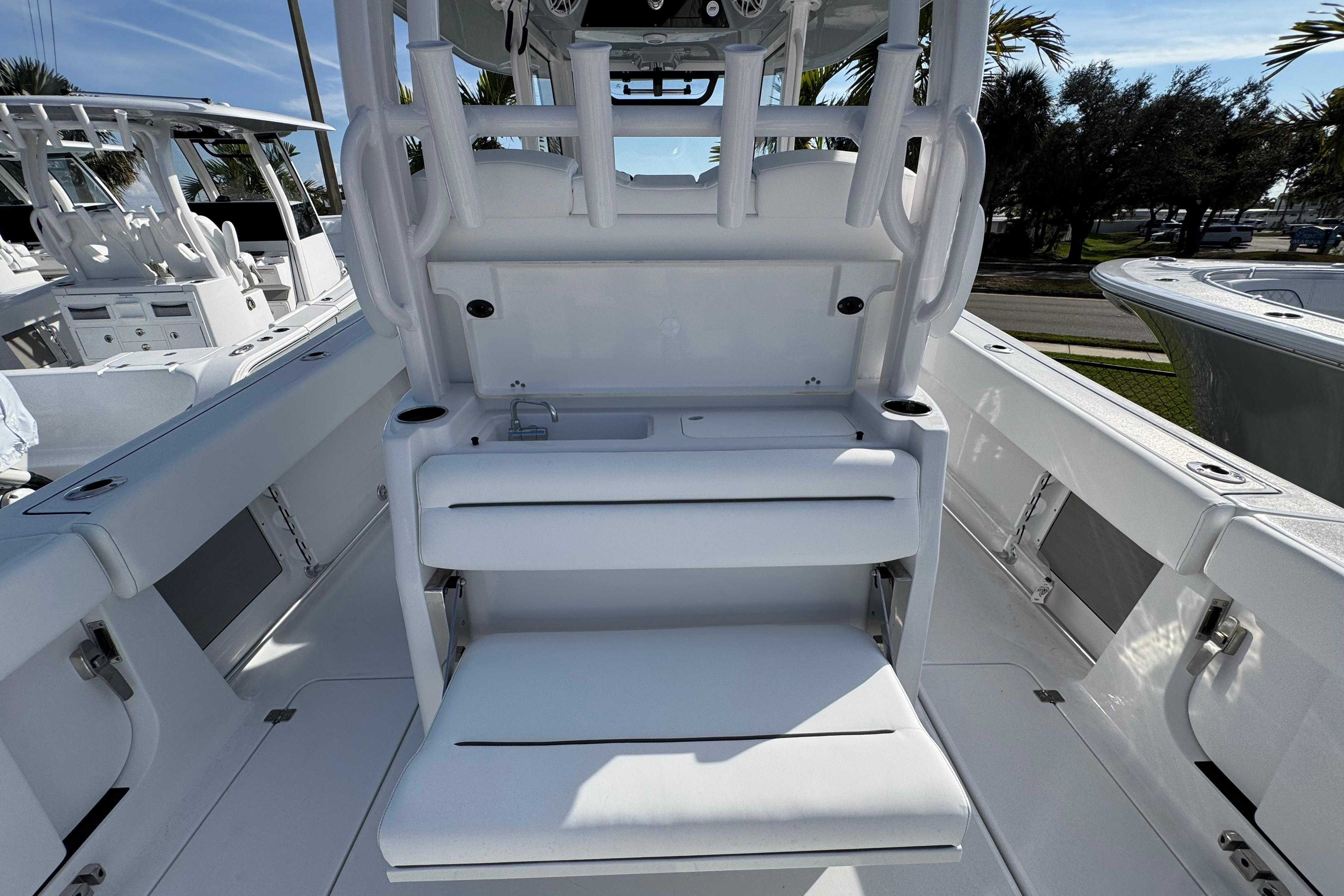 2026 Sportsman Open 302 Center Console boat interior with seating and storage.