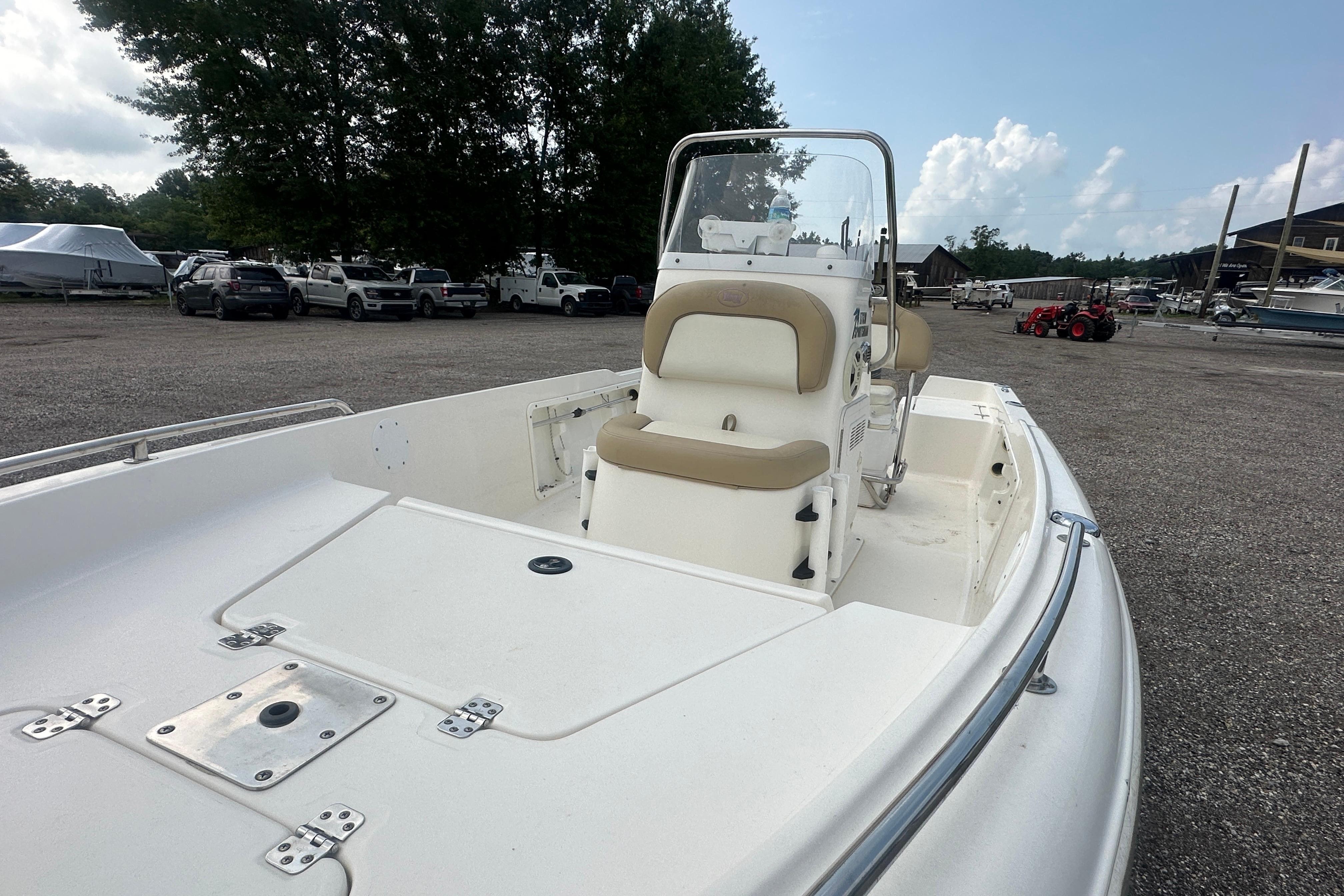 2018 Key West 1720 Center Console boat in a marina parking area.