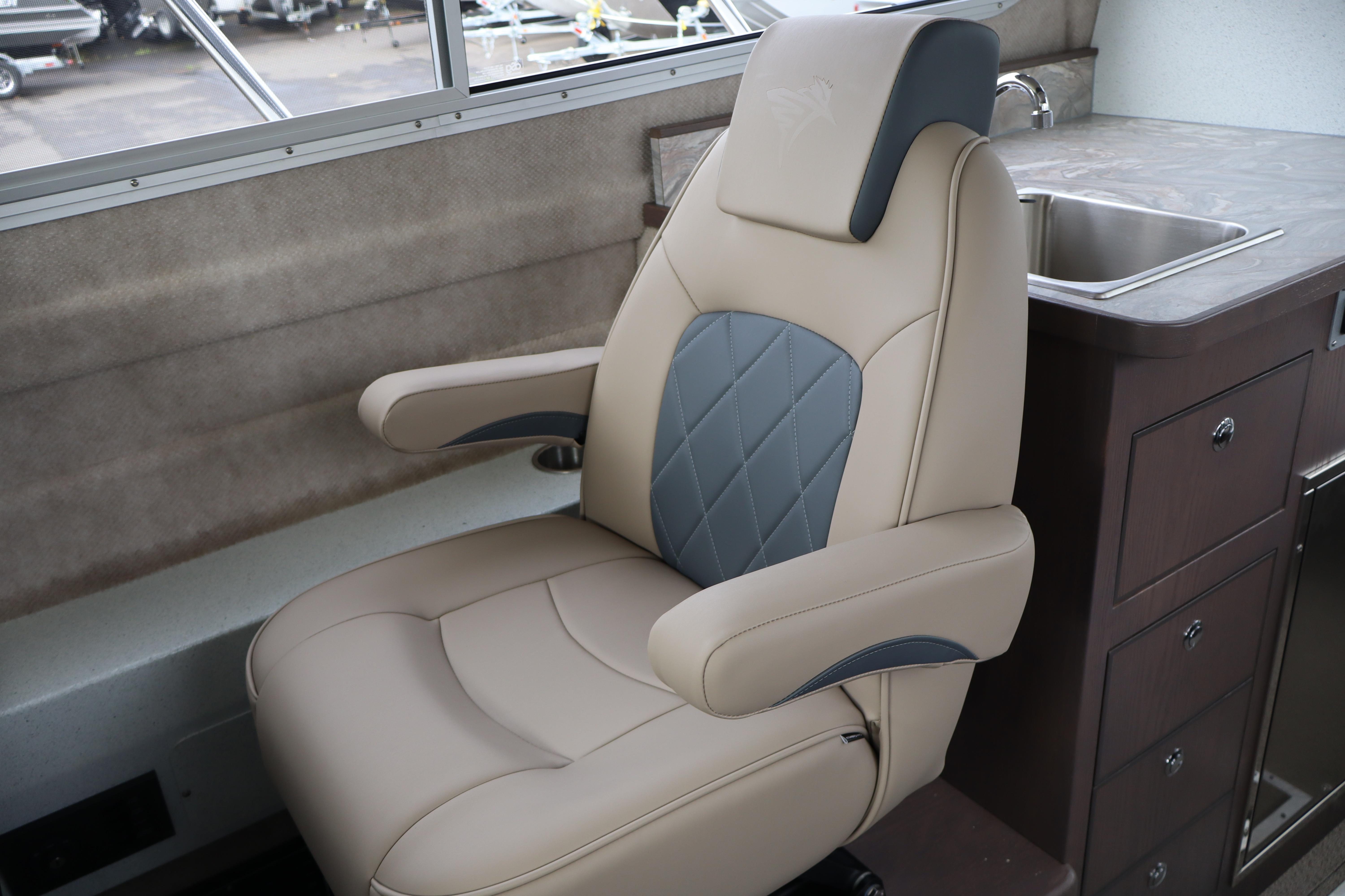 Luxurious captain's chair in 2026 KingFisher 3025 XRS boat interior, featuring elegant design.