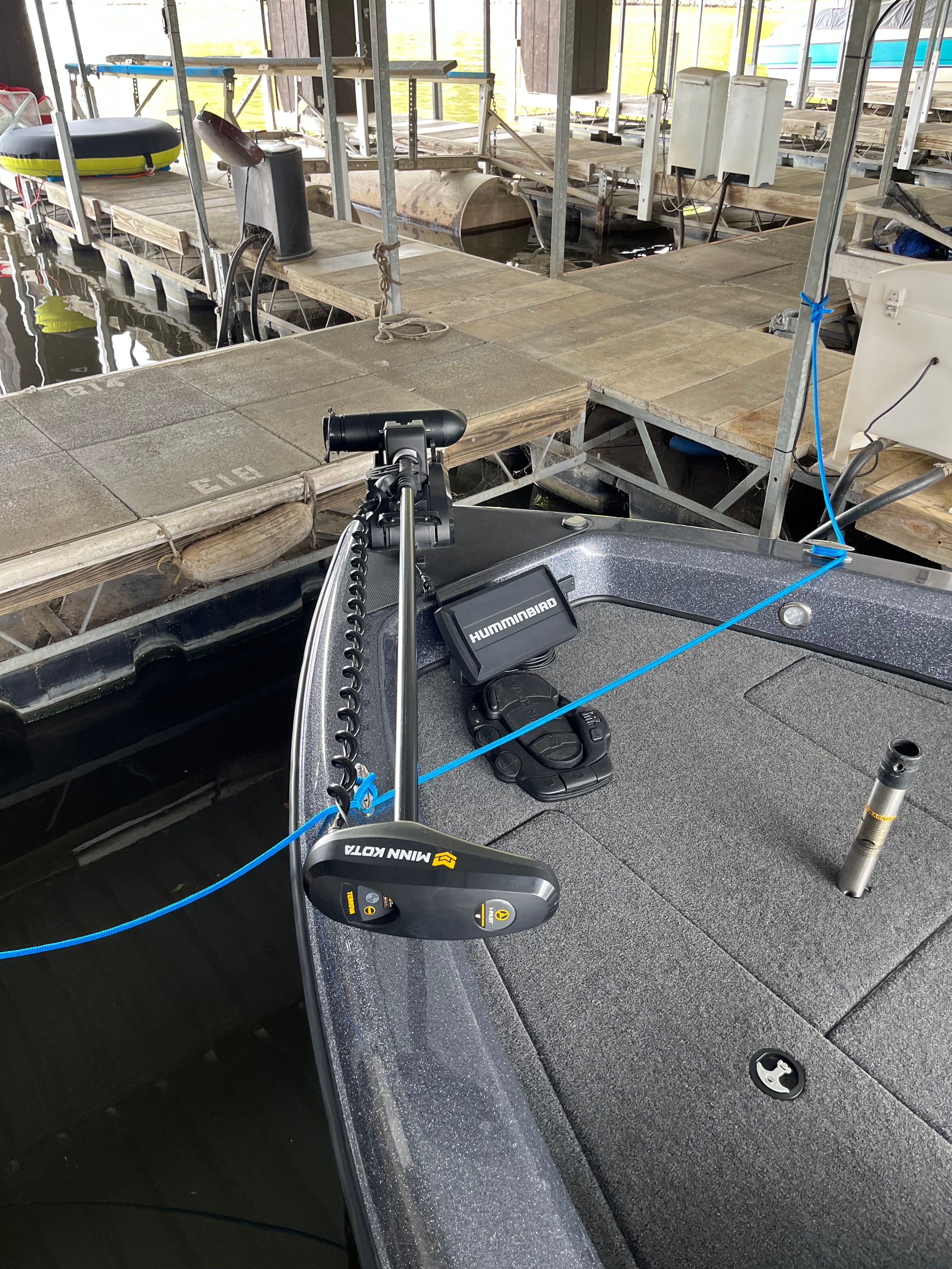 Triton 186 Fishunter 2023: Fishing boat with Minn Kota motor and Humminbird electronics, docked.