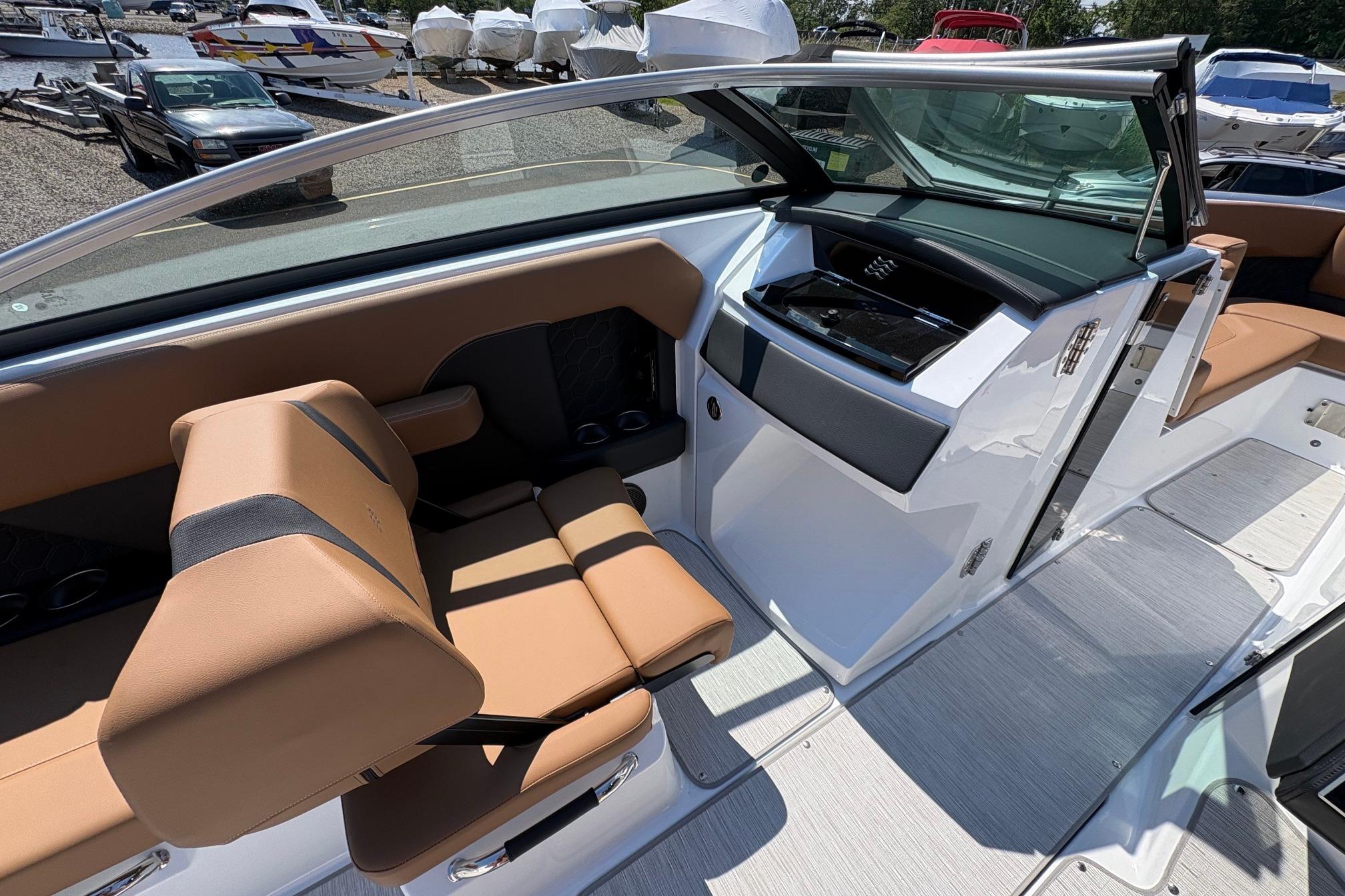 Interior of 2026 Four Winns H6 boat with tan seating and sleek design.