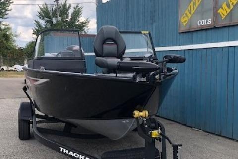 2026 Tracker Pro Guide V-175 Combo boat on trailer, parked outdoors.