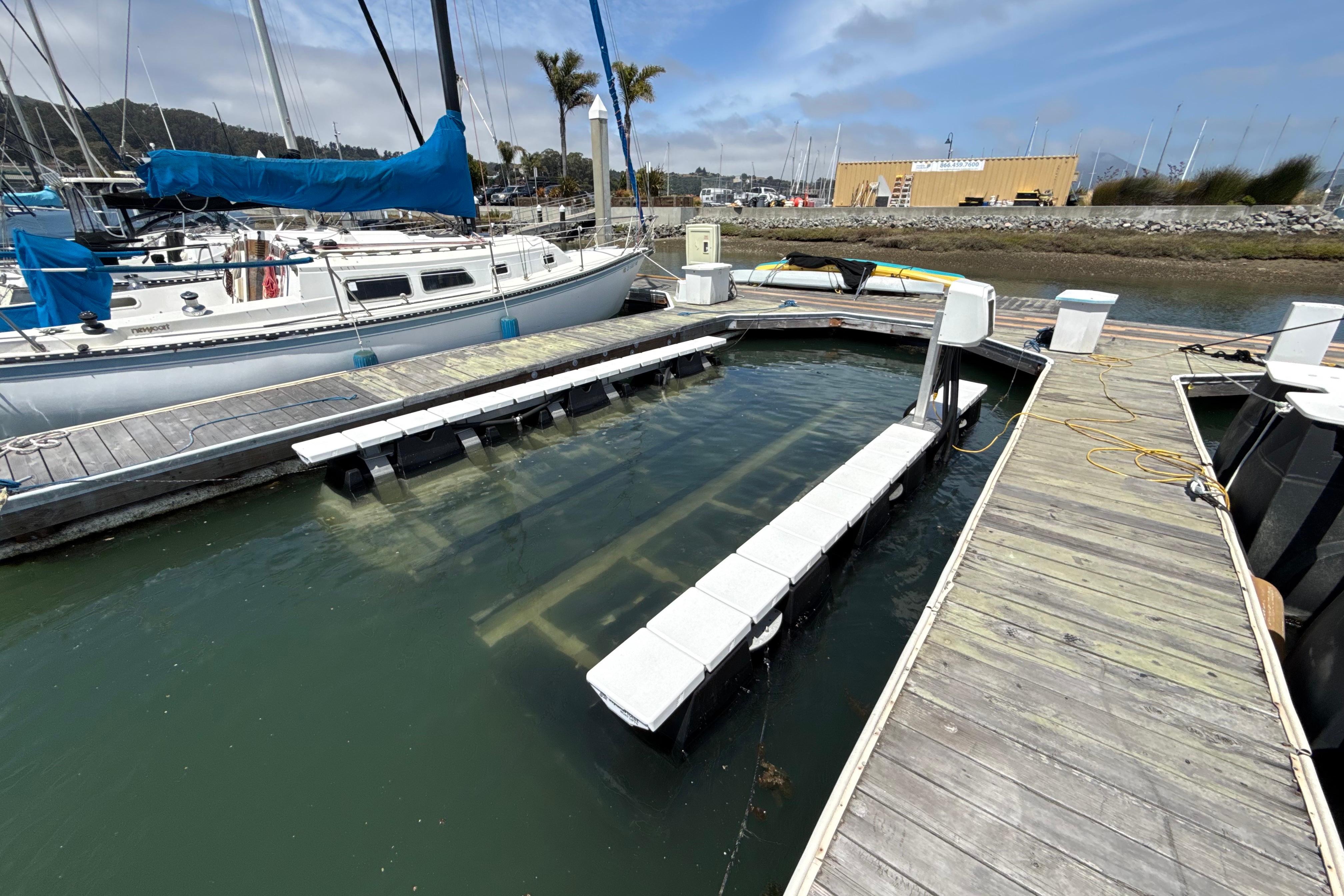 Floating dock at marina, designed for Bayliner VR5 Bowrider I/O, 2021 model.