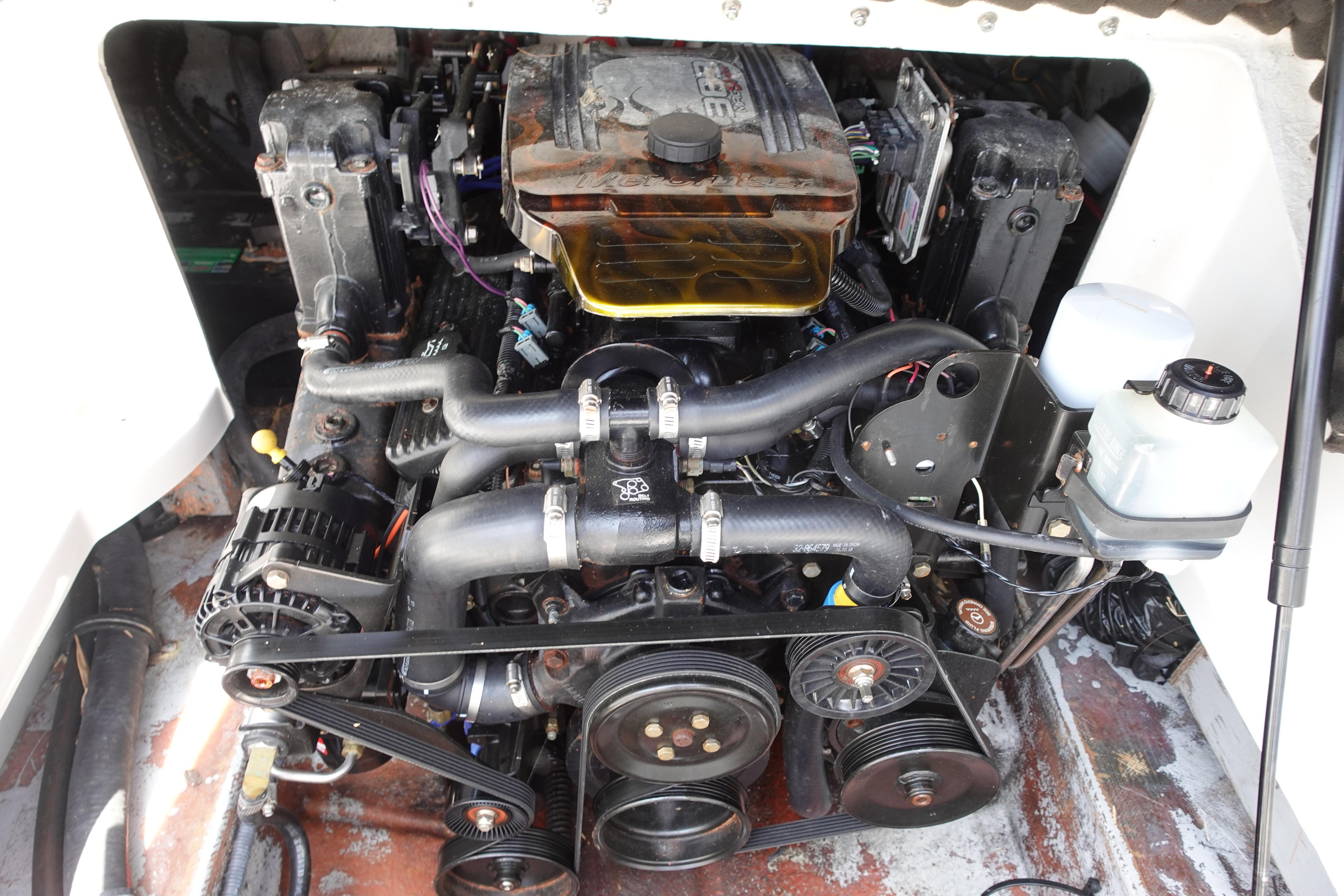 2004 Crownline 240 EX boat engine compartment with visible components and wiring.